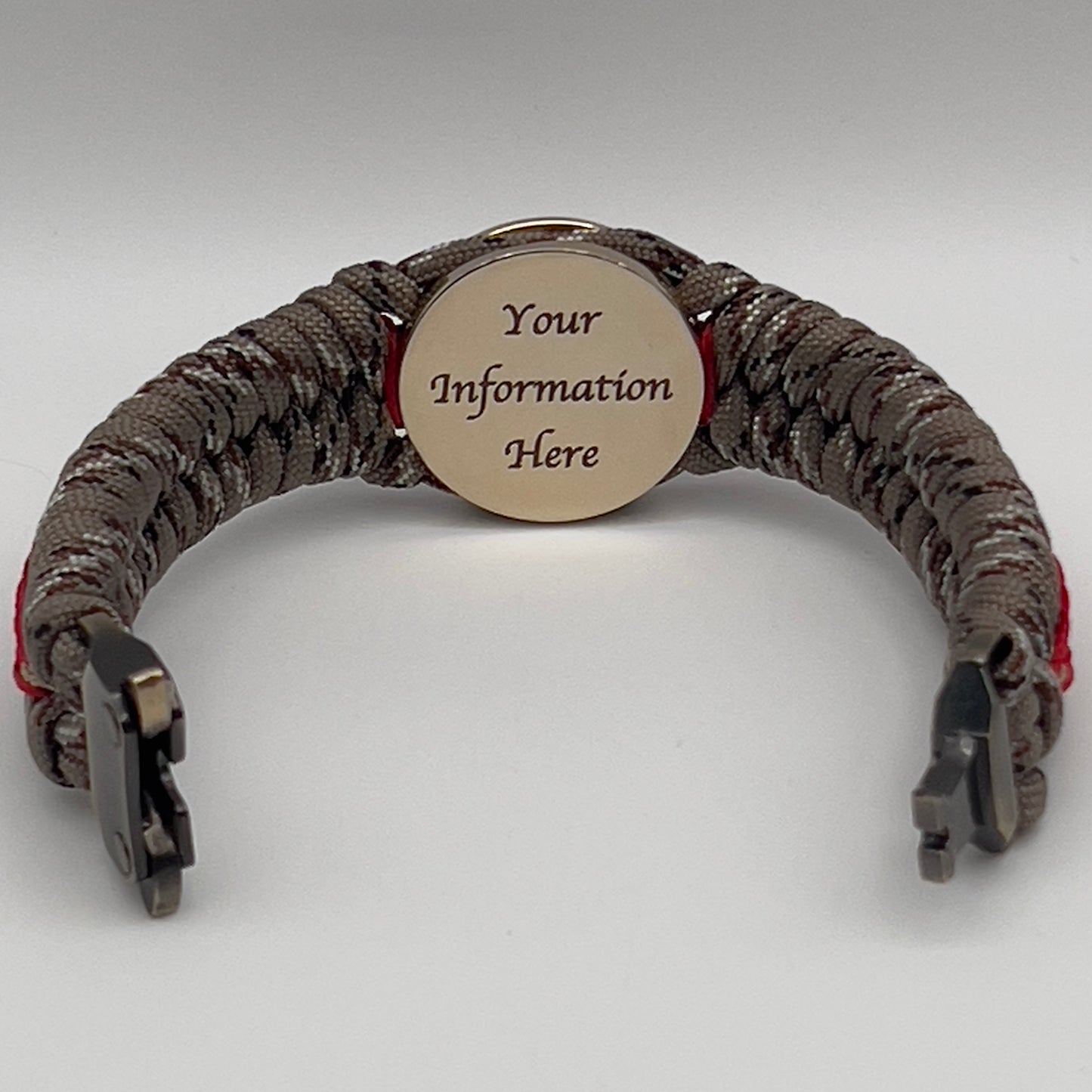 Thick, rigid and comfortable braided United States Marine Corps bracelet featuring a 24K gold plated USMC Eagle Globe and Anchor medallion, a gold Cobra style tactical buckle and woven with Desert Camo 550 paracord and Imperial Red and Gold micro cord.