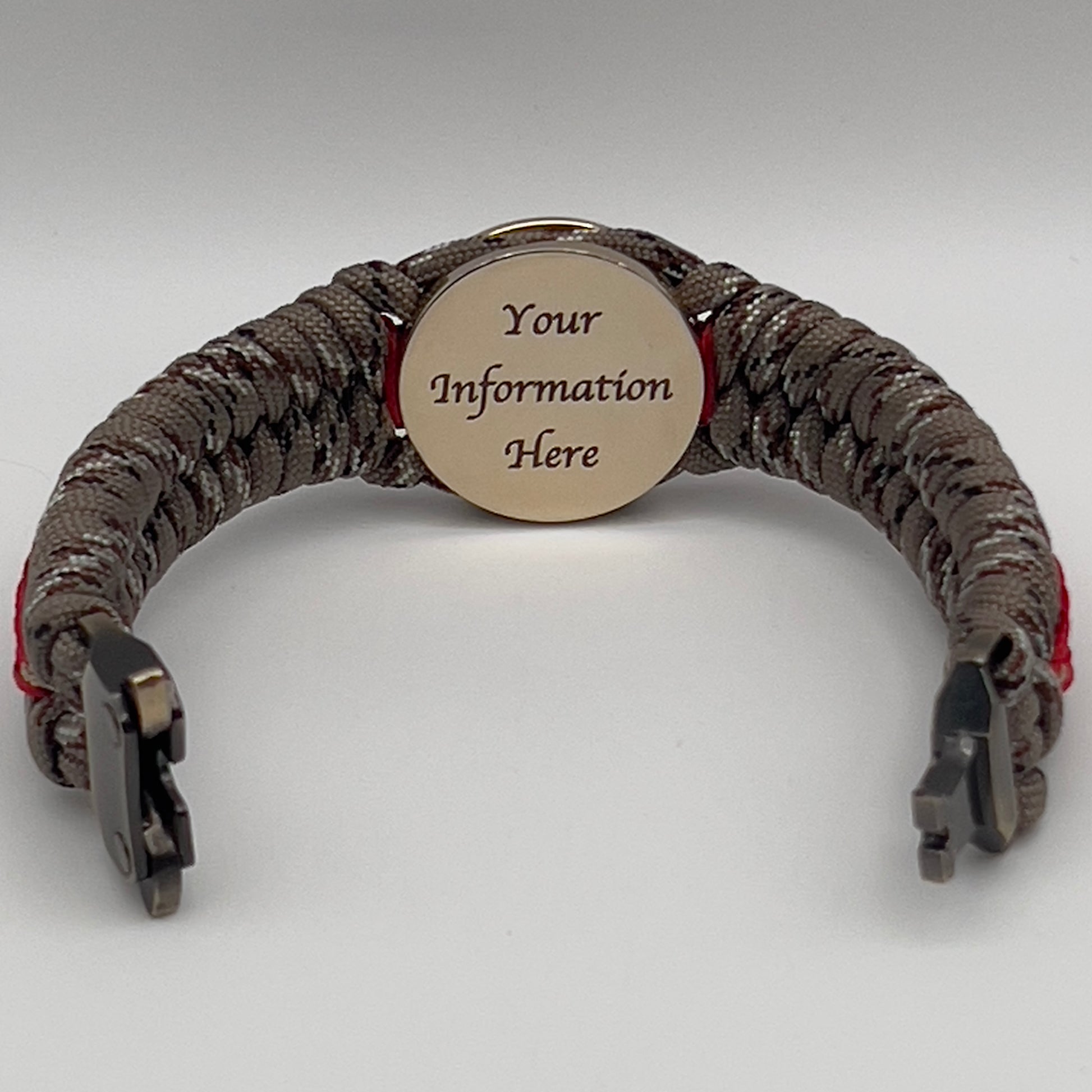 Thick, rigid and comfortable braided United States Marine Corps bracelet featuring a 24K gold plated USMC Eagle Globe and Anchor medallion, a gold Cobra style tactical buckle and woven with Desert Camo 550 paracord and Imperial Red and Gold micro cord.