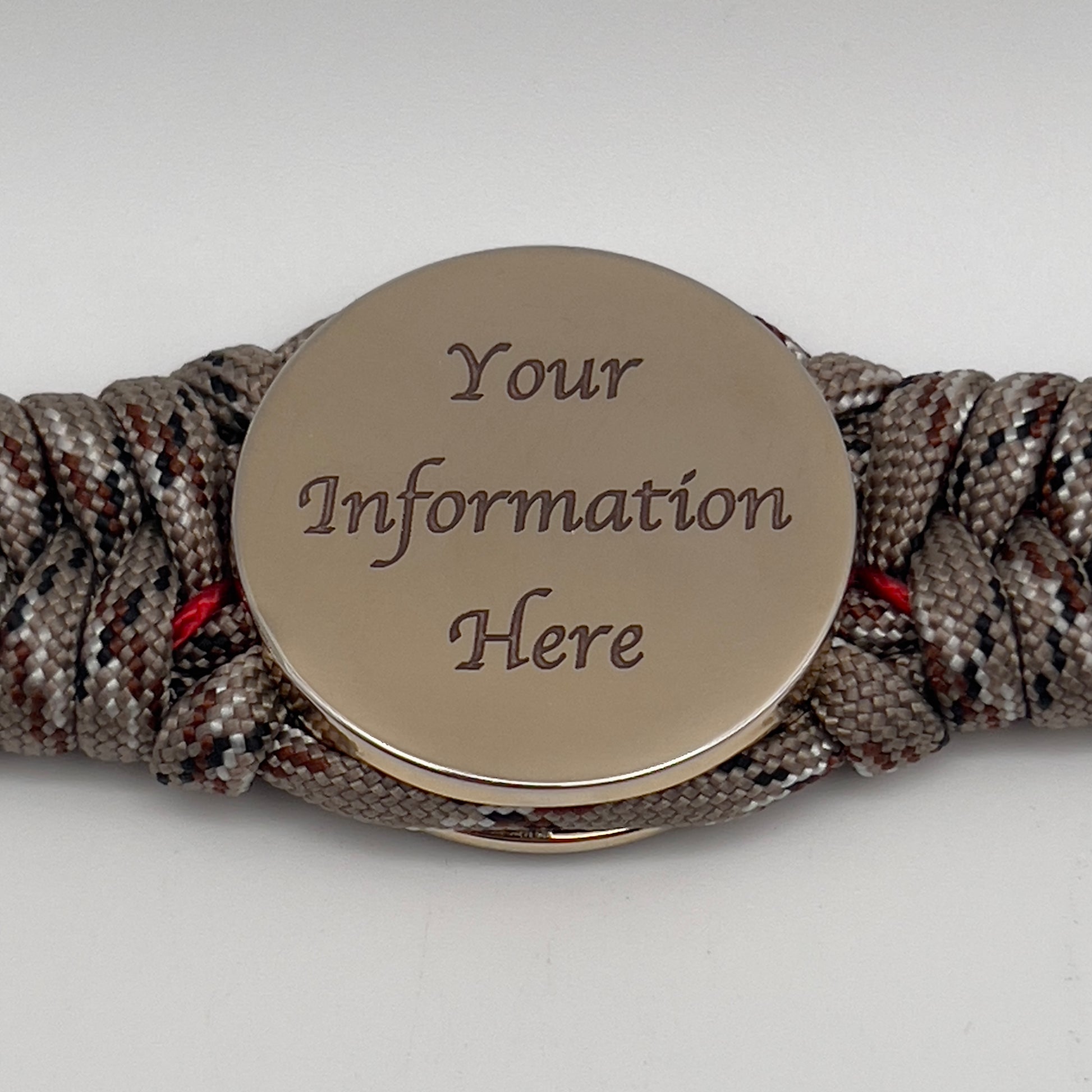 Thick, rigid and comfortable braided United States Marine Corps bracelet featuring a 24K gold plated USMC Eagle Globe and Anchor medallion, a gold Cobra style tactical buckle and woven with Desert Camo 550 paracord and Imperial Red micro cord.