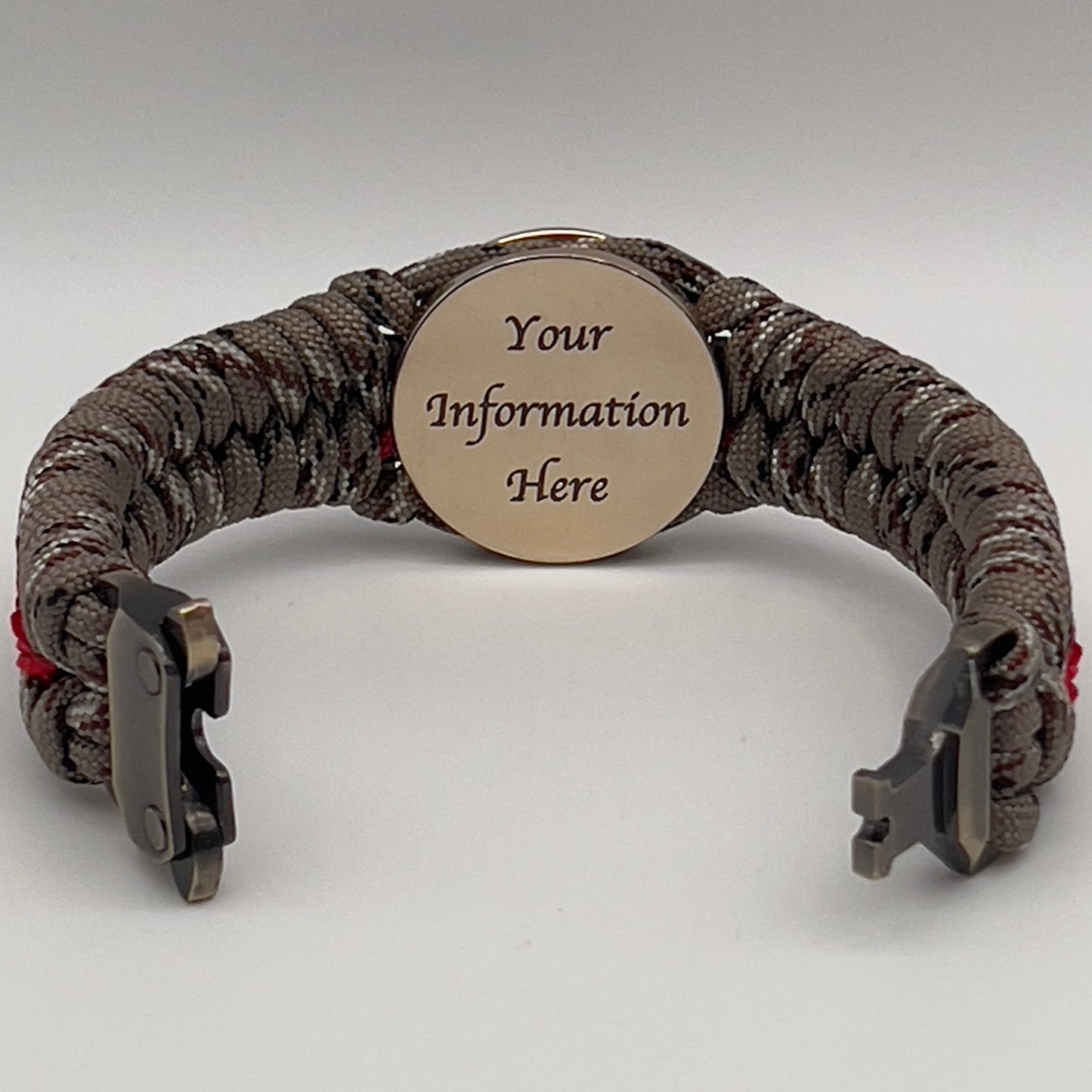 Thick, rigid and comfortable braided United States Marine Corps bracelet featuring a 24K gold plated USMC Eagle Globe and Anchor medallion, a gold Cobra style tactical buckle and woven with Desert Camo 550 paracord and Imperial Red micro cord.