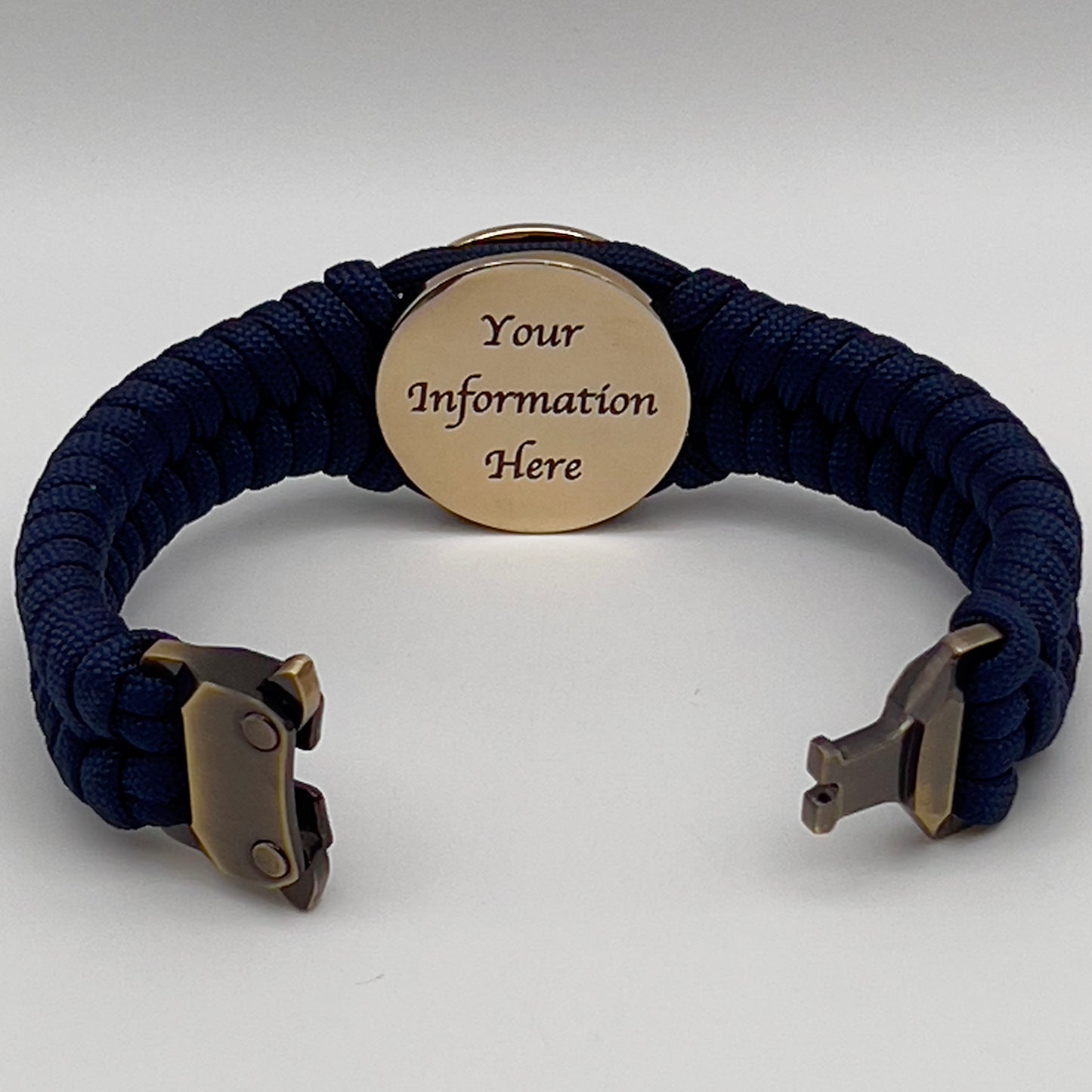 Thick, semi-rigid and comfortable braided United States Marine Corps bracelet featuring a 24K gold plated USMC Eagle Globe and Anchor medallion, a gold Cobra style tactical buckle and woven with Navy Blue 550 paracord.