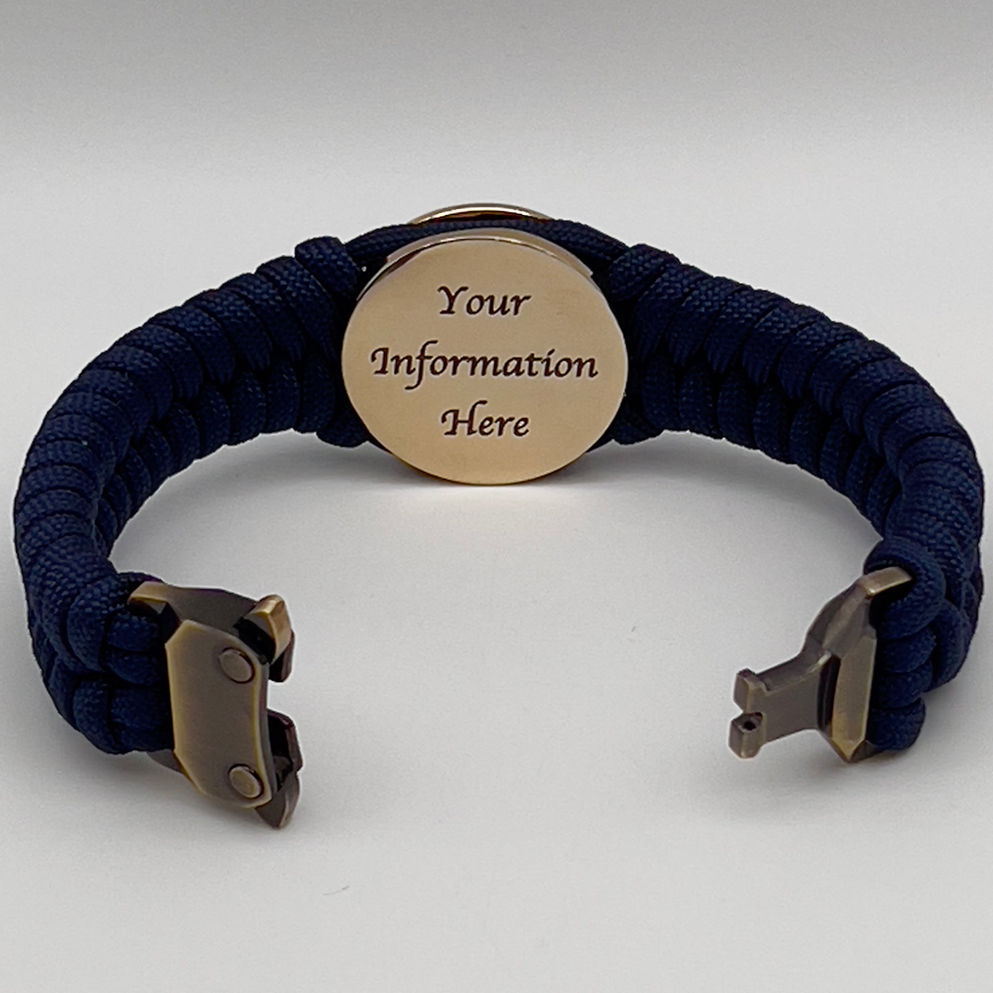Thick, semi-rigid and comfortable braided United States Marine Corps bracelet featuring a 24K gold plated USMC Eagle Globe and Anchor medallion, a gold Cobra style tactical buckle and woven with Navy Blue 550 paracord.