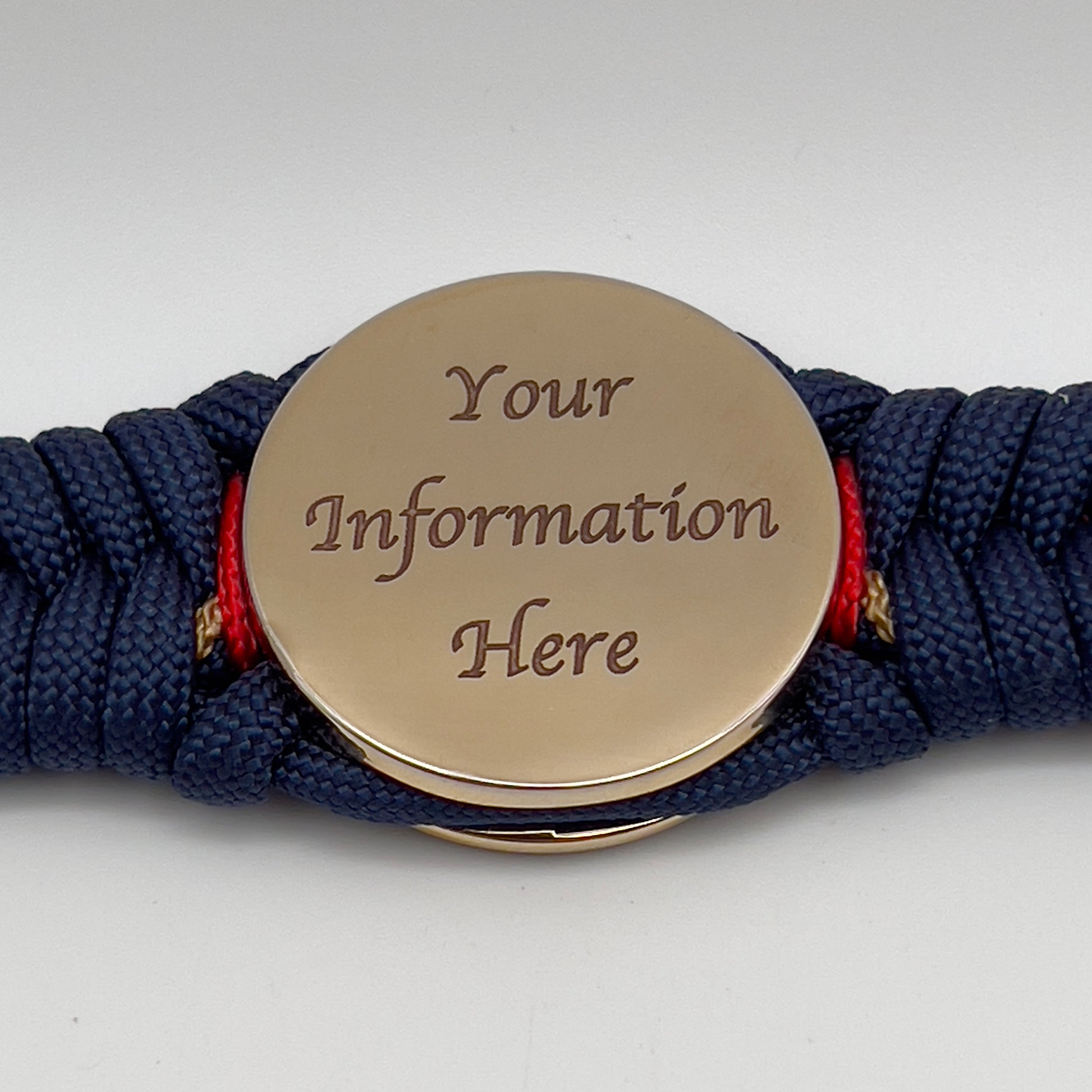 Thick, rigid and comfortable braided United States Marine Corps bracelet featuring a 24K gold plated USMC Eagle Globe and Anchor medallion, a gold Cobra style tactical buckle and woven with Navy Blue 550 paracord and Imperial Red and Gold micro cord.