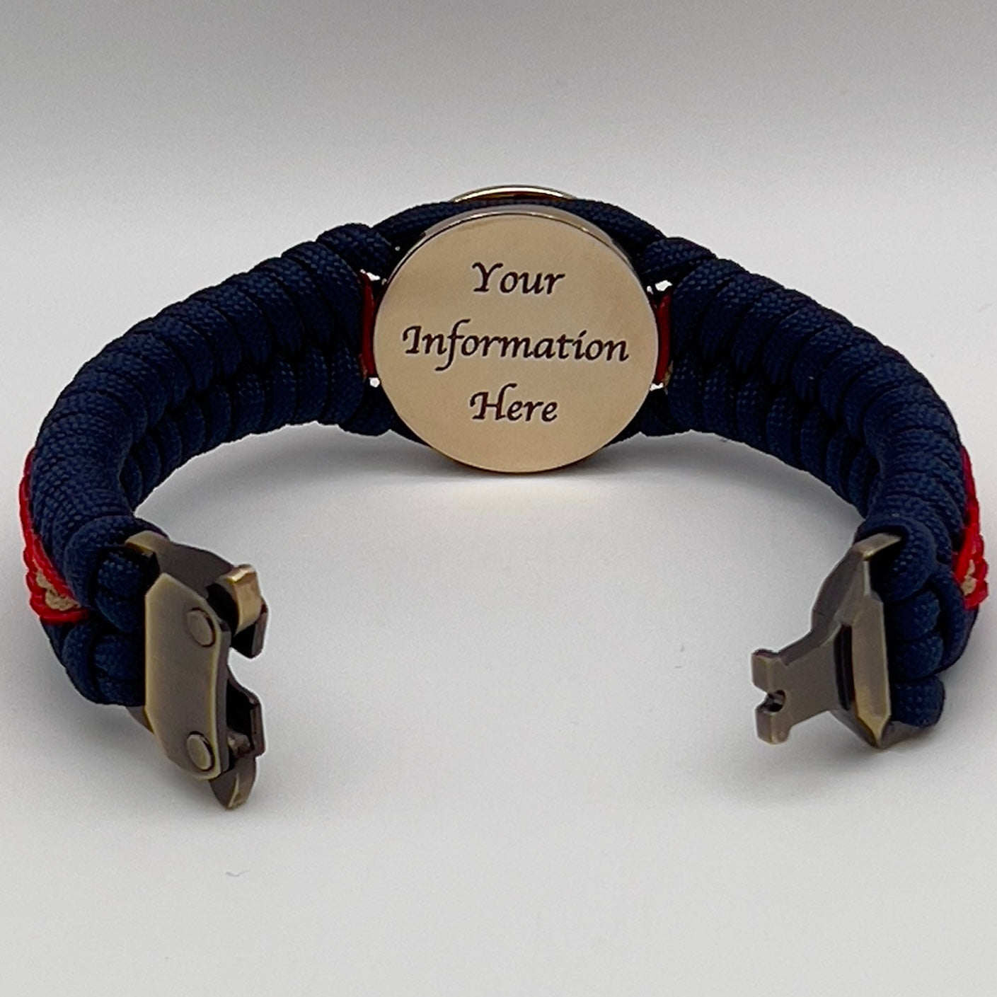 Thick, rigid and comfortable braided United States Marine Corps bracelet featuring a 24K gold plated USMC Eagle Globe and Anchor medallion, a gold Cobra style tactical buckle and woven with Navy Blue 550 paracord and Imperial Red and Gold micro cord.