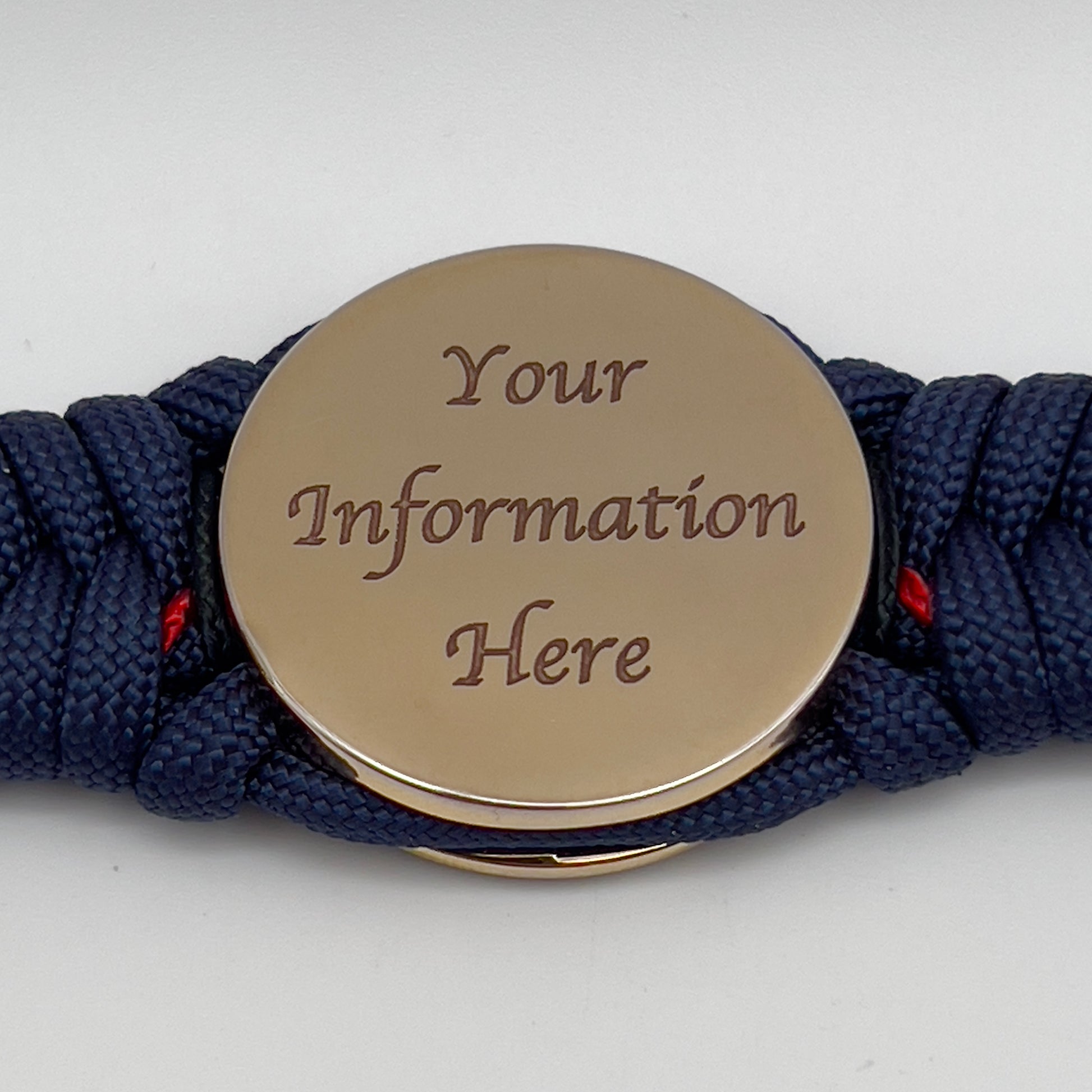 Thick, rigid and comfortable braided United States Marine Corps bracelet featuring a 24K gold plated USMC Eagle Globe and Anchor medallion, a gold Cobra style tactical buckle and woven with Navy Blue 550 paracord and Imperial Red and Black micro cord.