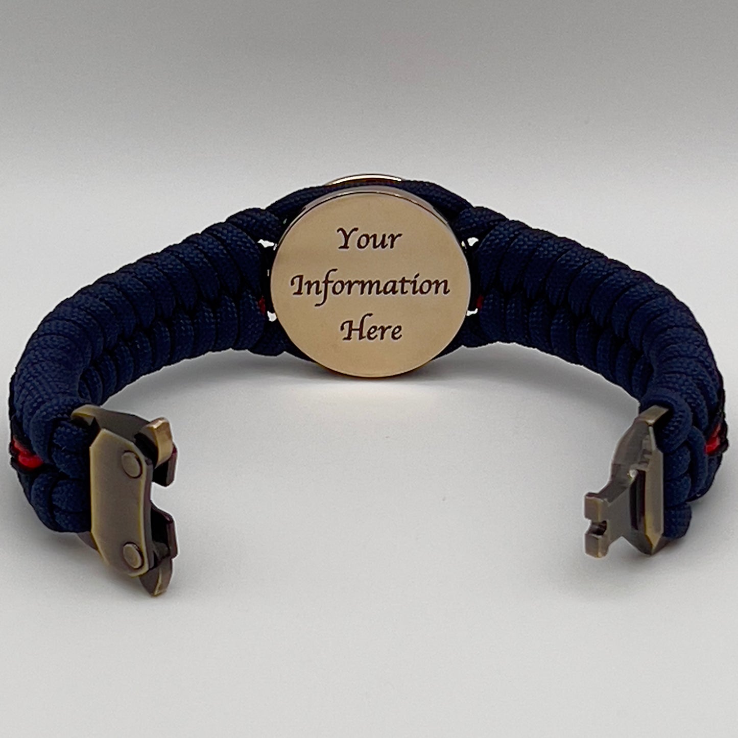 Thick, rigid and comfortable braided United States Marine Corps bracelet featuring a 24K gold plated USMC Eagle Globe and Anchor medallion, a gold Cobra style tactical buckle and woven with Navy Blue 550 paracord and Imperial Red and Black micro cord.