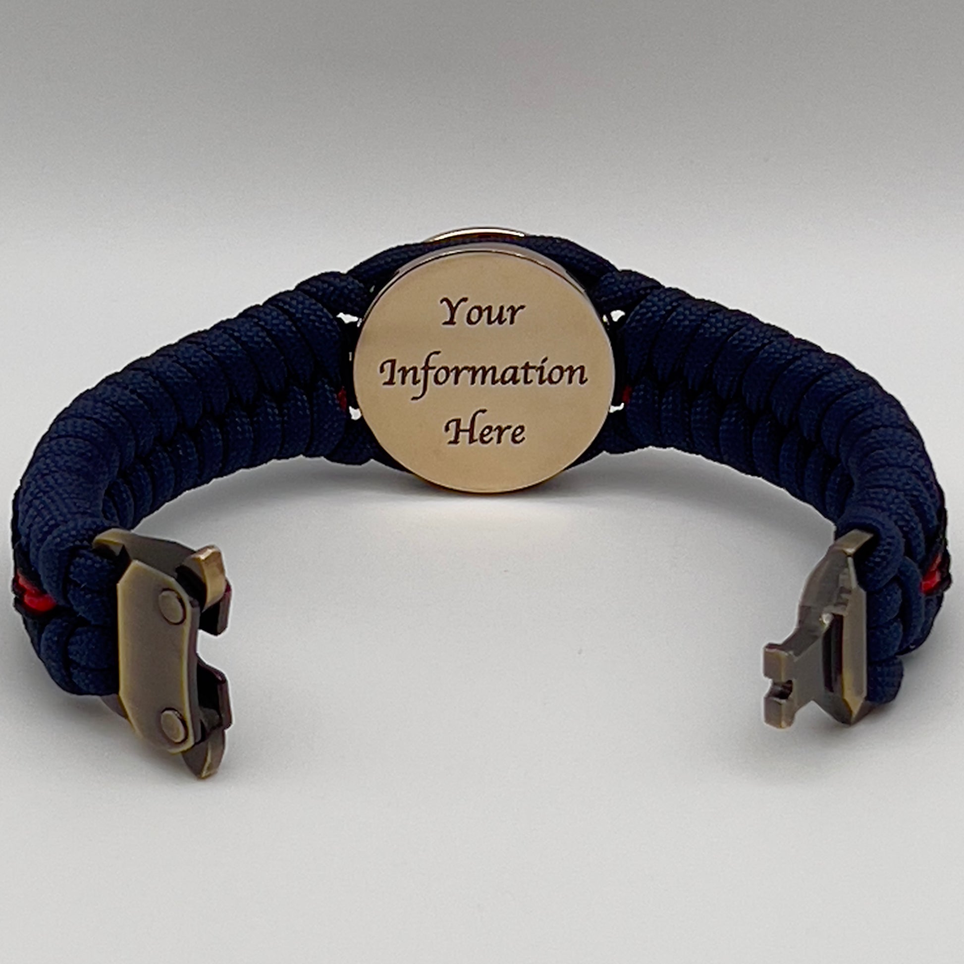 Thick, rigid and comfortable braided United States Marine Corps bracelet featuring a 24K gold plated USMC Eagle Globe and Anchor medallion, a gold Cobra style tactical buckle and woven with Navy Blue 550 paracord and Imperial Red and Black micro cord.