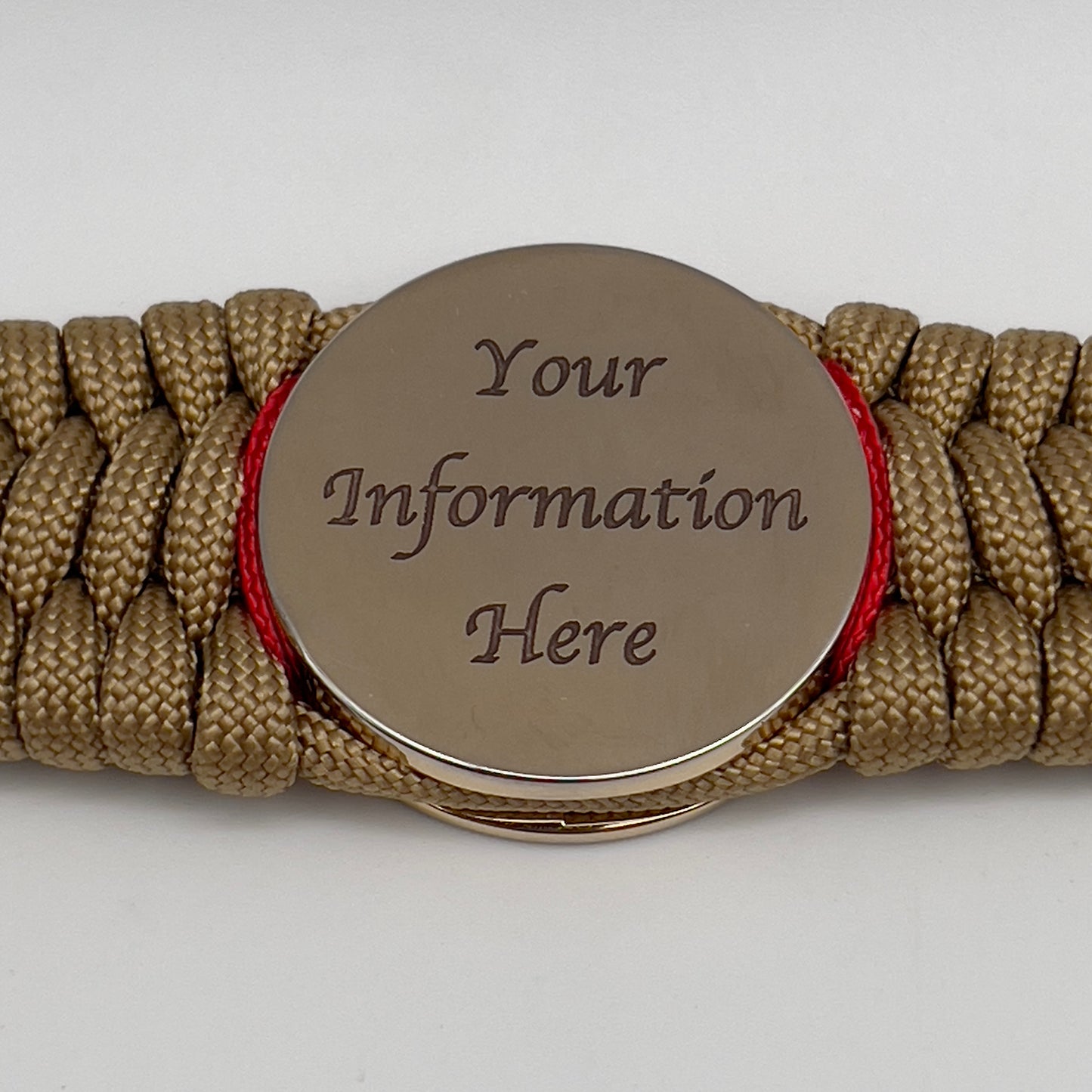 Thick, wide, rigid and comfortable braided United States Marine Corps bracelet featuring a 24K gold plated USMC Eagle Globe and Anchor medallion, a gold Cobra style tactical buckle and woven with gold 550 paracord and Imperial Red nano and micro cord.