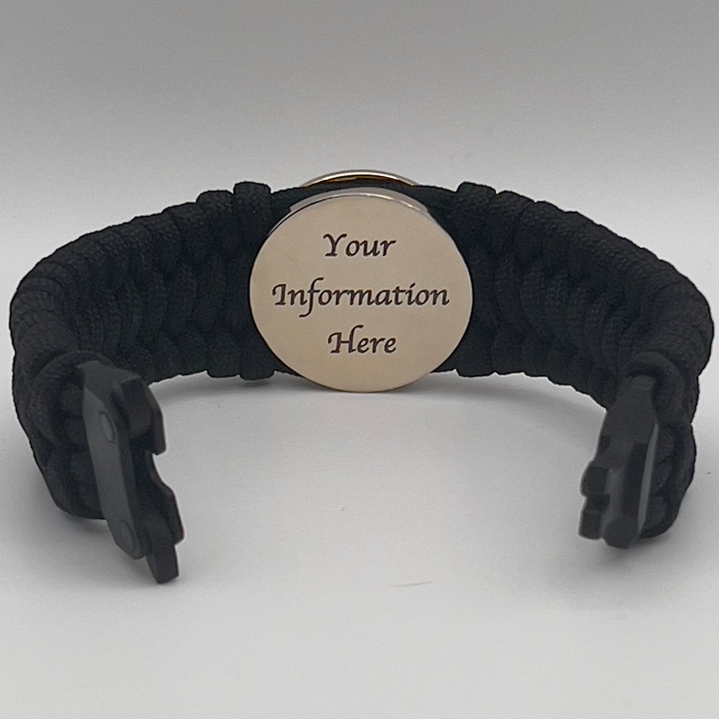 Thick, wide, rigid and comfortable braided United States Marine Corps bracelet featuring a 24K gold plated USMC Eagle Globe and Anchor medallion, a black Cobra style tactical buckle and woven with black 550 paracord.