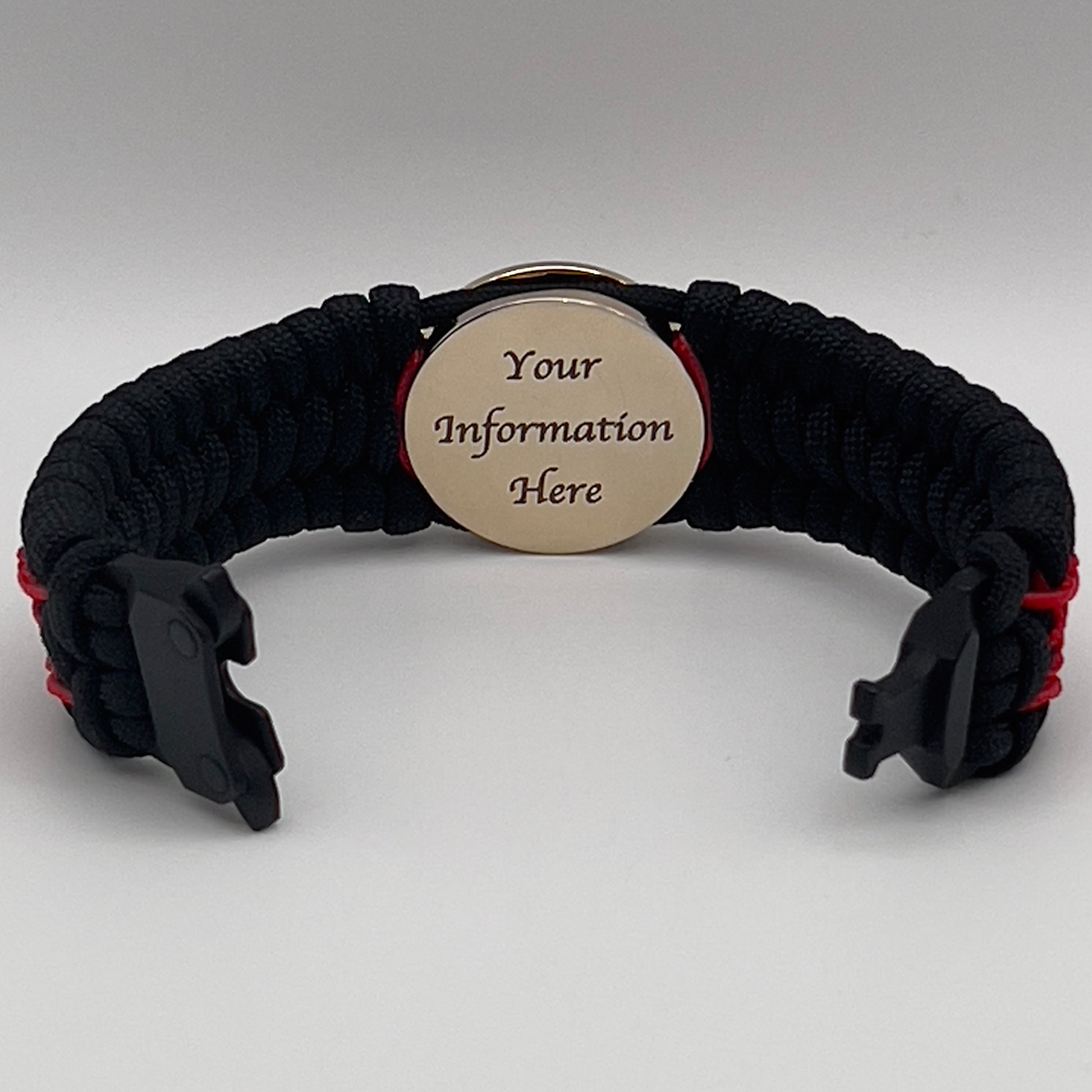 Thick, wide, rigid and comfortable braided United States Marine Corps bracelet featuring a 24K gold plated USMC Eagle Globe and Anchor medallion, a black Cobra style tactical buckle and woven with black 550 paracord and Imperial Red nano and micro cord.