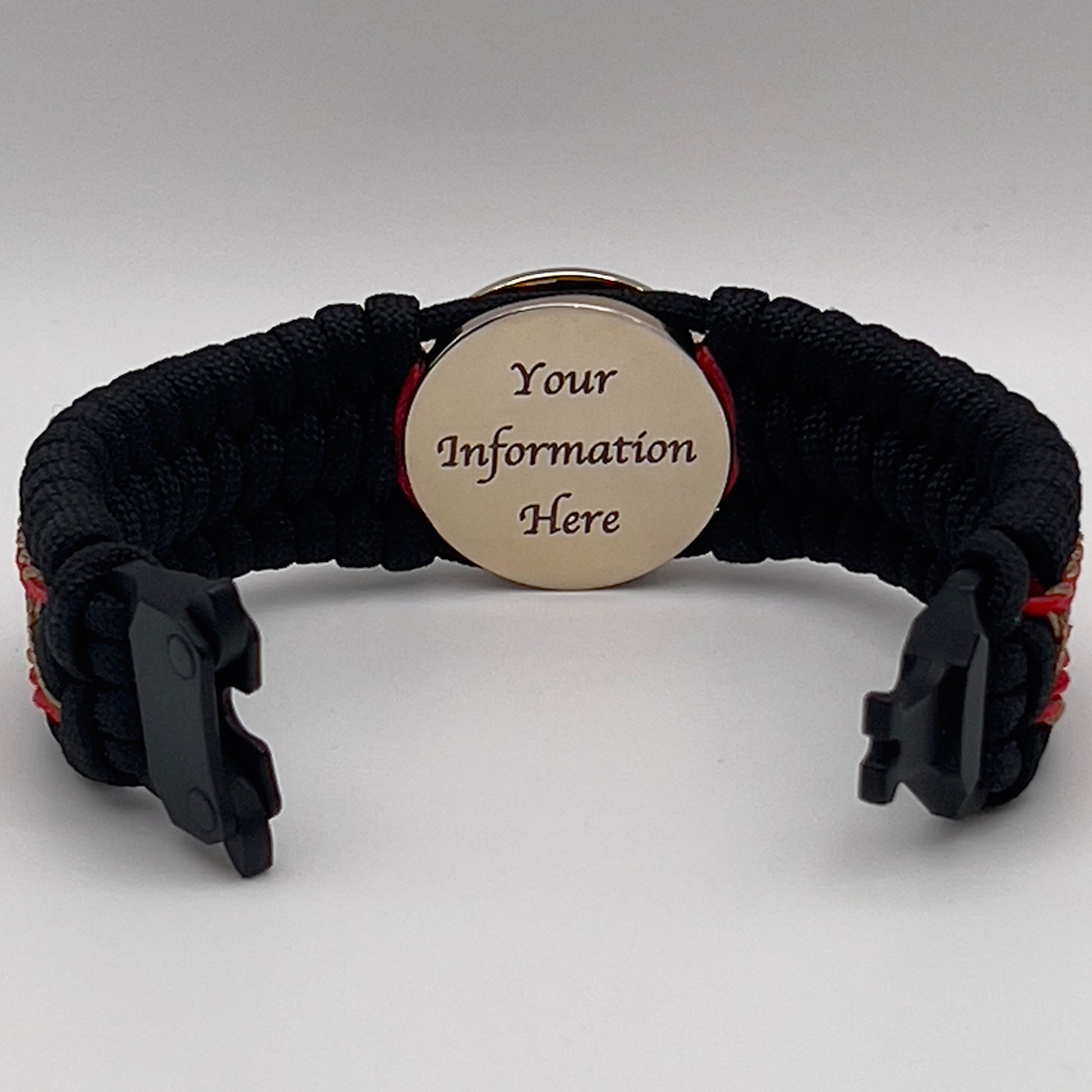Thick, wide, rigid and comfortable braided United States Marine Corps bracelet featuring a 24K gold plated USMC Eagle Globe and Anchor medallion, a black Cobra style tactical buckle and woven with black 550 paracord and Imperial Red micro and gold nano cord.