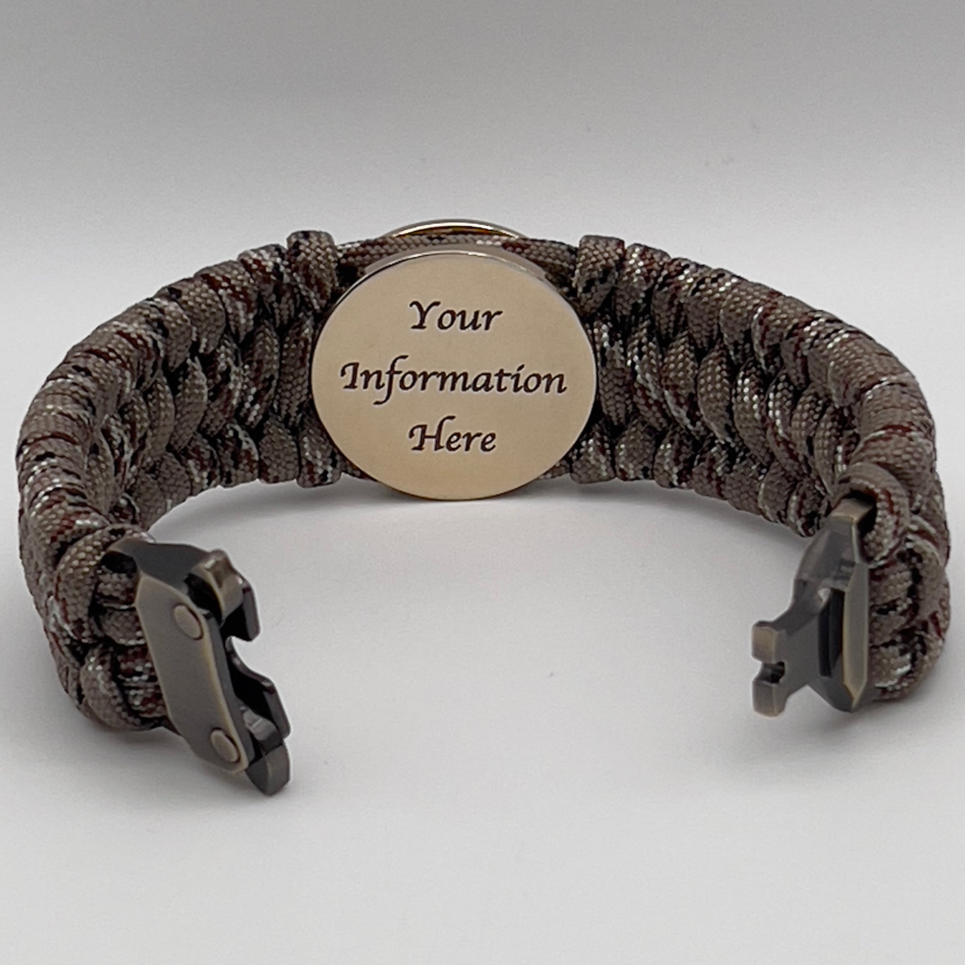 Thick, wide, semi-rigid and comfortable braided United States Marine Corps bracelet featuring a 24K gold plated USMC Eagle Globe and Anchor medallion, a gold Cobra style tactical buckle and woven with Desert Camo 550 paracord.