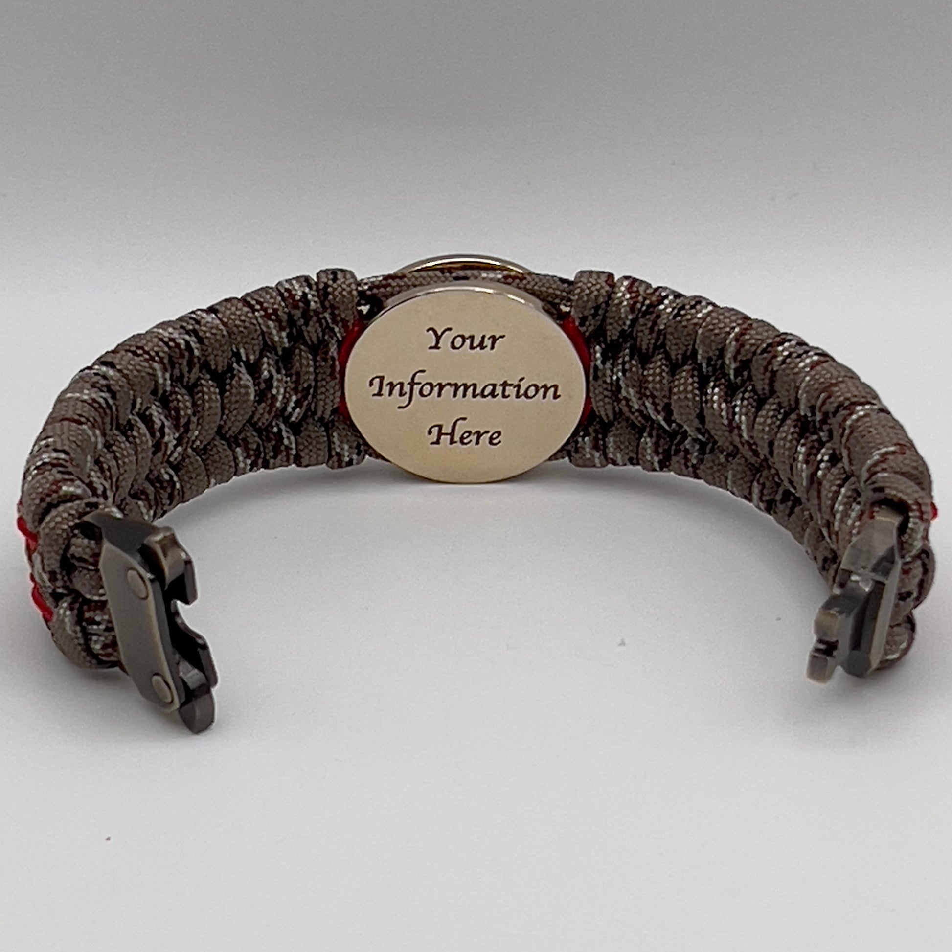 Thick, wide, rigid and comfortable braided United States Marine Corps bracelet featuring a 24K gold plated USMC Eagle Globe and Anchor medallion, a gold Cobra style tactical buckle and woven with Desert Camo 550 paracord and Imperial Red micro and gold nano cord.