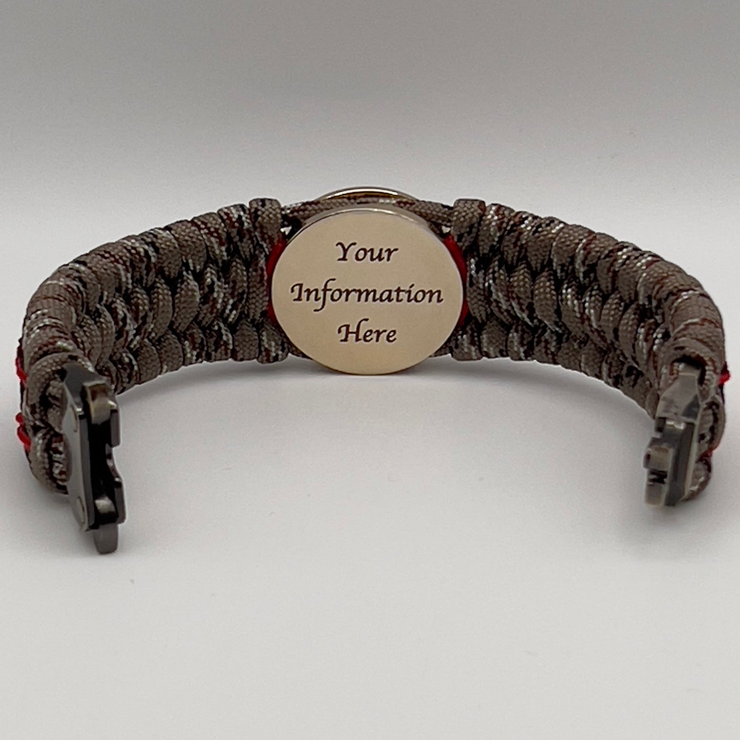 Thick, wide, rigid and comfortable braided United States Marine Corps bracelet featuring a 24K gold plated USMC Eagle Globe and Anchor medallion, a gold Cobra style tactical buckle and woven with Desert Camo 550 paracord, Imperial Red micro cord and black nano cord.