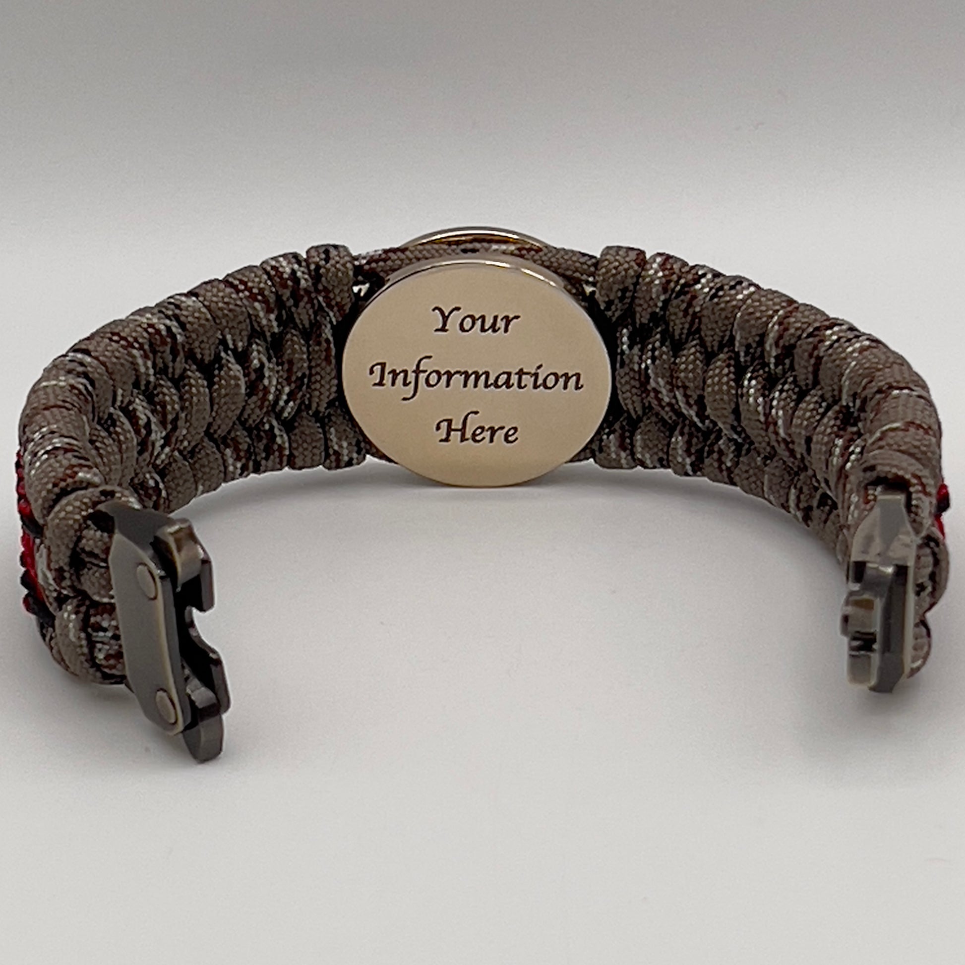 Thick, wide, rigid and comfortable braided United States Marine Corps bracelet featuring a 24K gold plated USMC Eagle Globe and Anchor medallion, a gold Cobra style tactical buckle and woven with Desert Camo 550 paracord, black micro cord and Imperial Red nano cord.