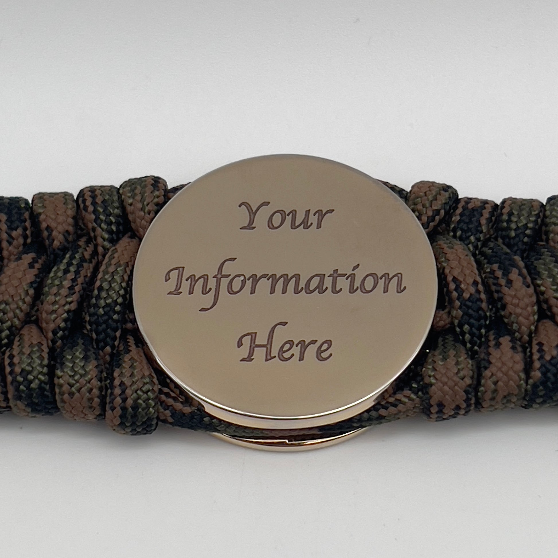 Thick, wide, semi-rigid and comfortable braided United States Marine Corps bracelet featuring a 24K gold plated USMC Eagle Globe and Anchor medallion, a gold Cobra style tactical buckle and woven with Woodland Camo 550 paracord.