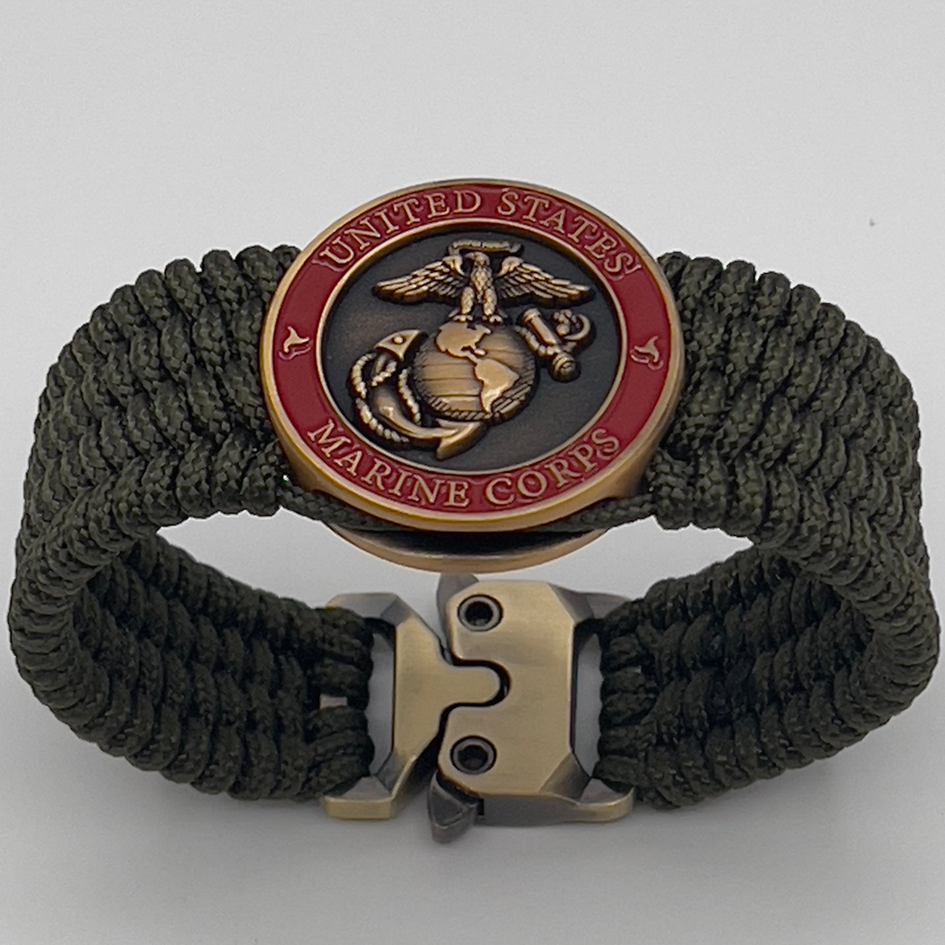 Thin, wide, very flexible and comfortable braided United States Marine Corps bracelet featuring a 24K antique gold plated USMC Eagle Globe and Anchor medallion, a gold Cobra style tactical buckle and woven with OIive Drab Type-1 paracord.