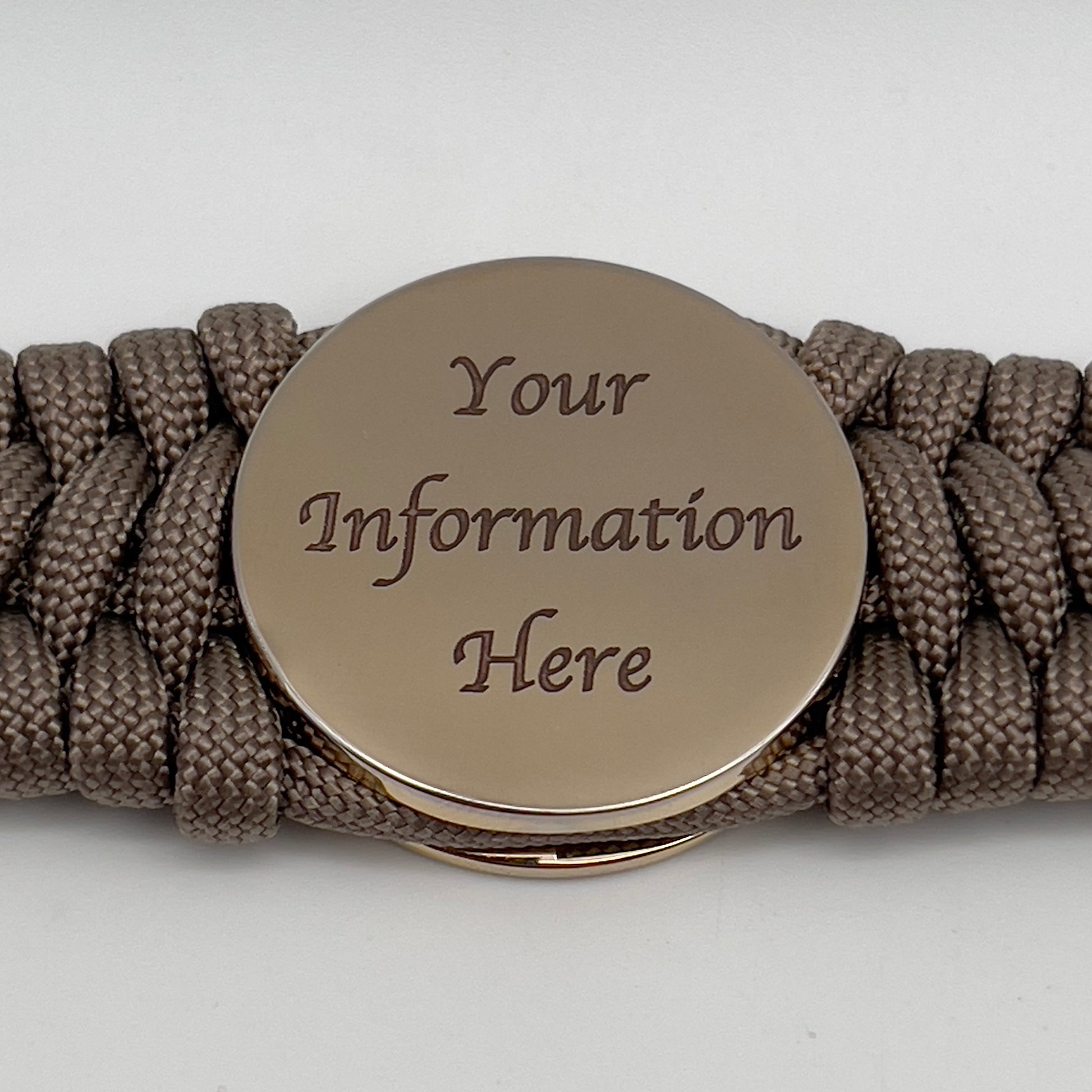 Thick, wide, semi-rigid and comfortable braided United States Marine Corps bracelet featuring a 24K gold plated USMC Eagle Globe and Anchor medallion, a gold Cobra style tactical buckle and woven with tan 550 paracord.