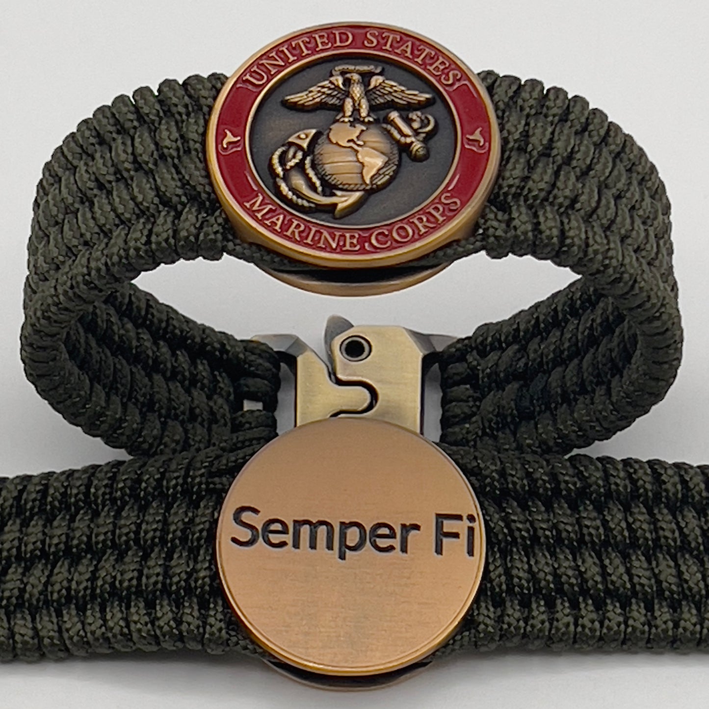 Thin, wide, very flexible and comfortable braided United States Marine Corps bracelet featuring a 24K antique gold plated USMC Eagle Globe and Anchor medallion, a gold Cobra style tactical buckle and woven with OIive Drab Type-1 paracord.