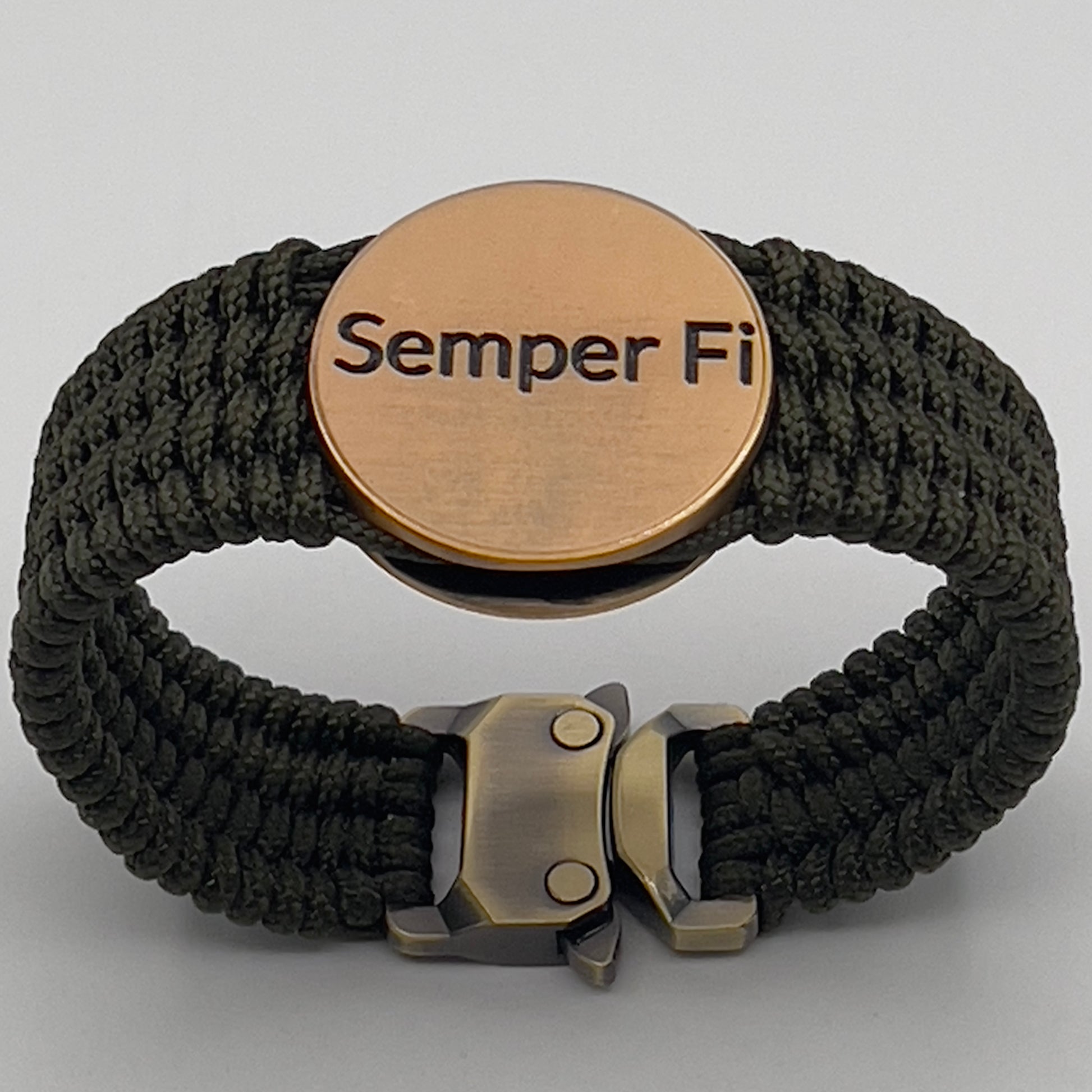 Thin, wide, very flexible and comfortable braided United States Marine Corps bracelet featuring a 24K antique gold plated USMC Eagle Globe and Anchor medallion, a gold Cobra style tactical buckle and woven with OIive Drab Type-1 paracord.