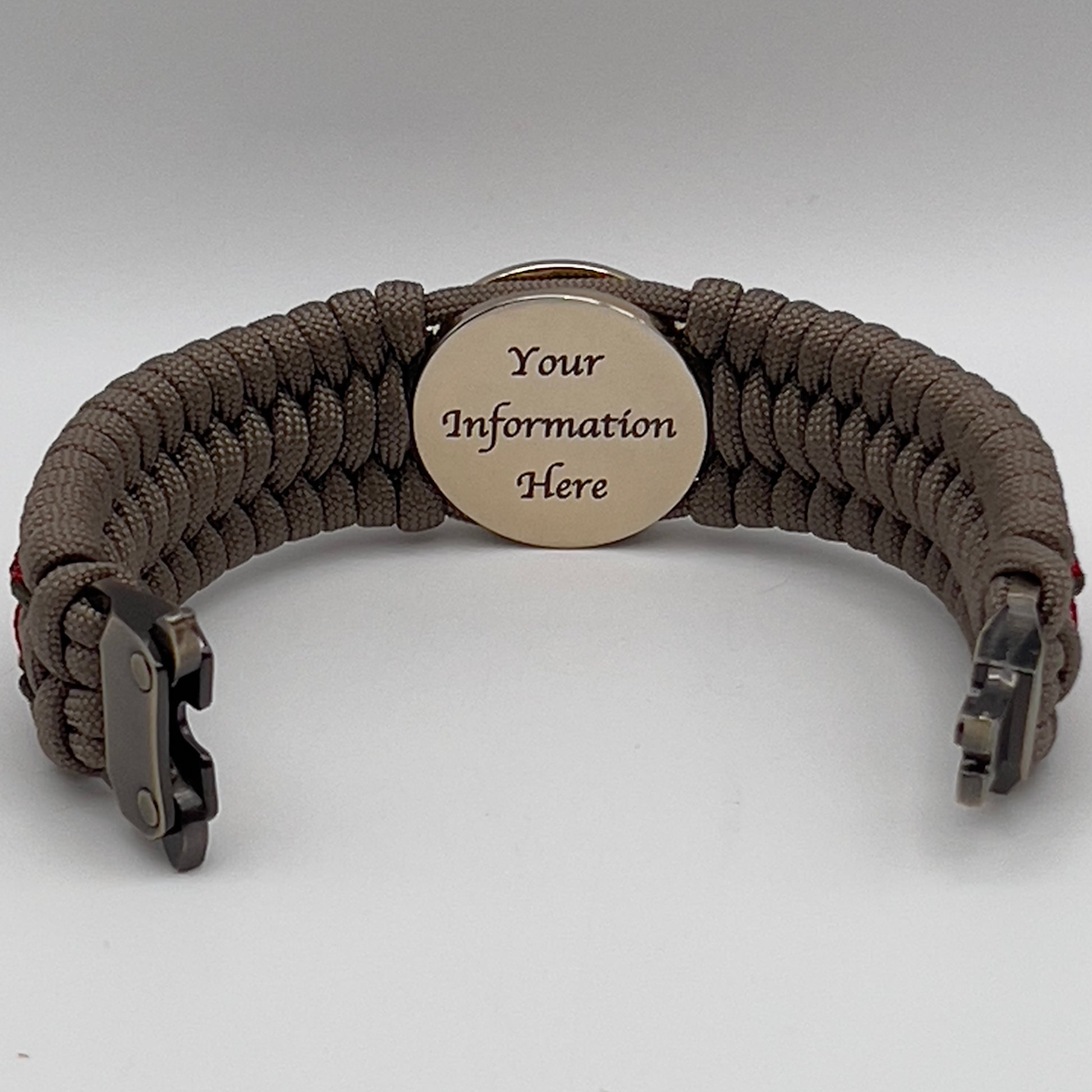 Thick, wide, rigid and comfortable braided United States Marine Corps bracelet featuring a 24K gold plated USMC Eagle Globe and Anchor medallion, a gold Cobra style tactical buckle and woven with tan 550 paracord, olive drab micro and Imperial red nano cord.