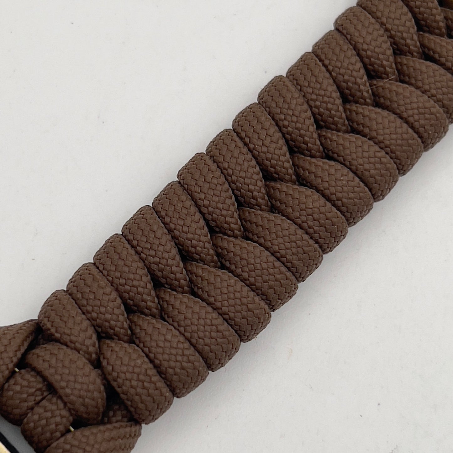 Thick, medium width, semi-rigid and comfortable braided United States Marine Corps bracelet featuring a 24K antique gold plated USMC Eagle Globe and Anchor medallion, a gold Cobra style tactical buckle and woven with Coyote Brown 550 paracord 