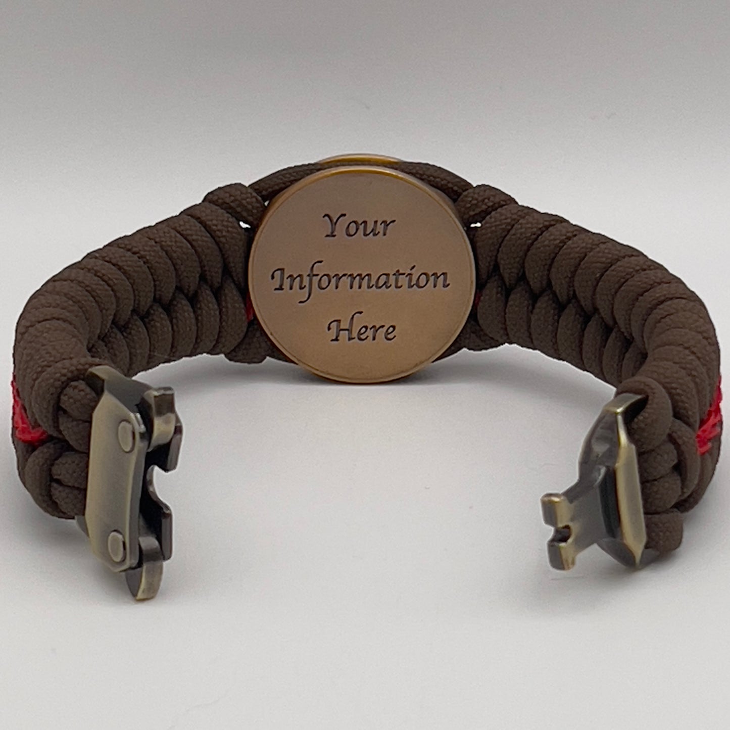 Thick, medium width, semi-rigid and comfortable braided United States Marine Corps bracelet featuring a 24K antique gold plated USMC Eagle Globe and Anchor medallion, a gold Cobra style tactical buckle and woven with Coyote Brown 550 paracord and Imperial Red micro cord.