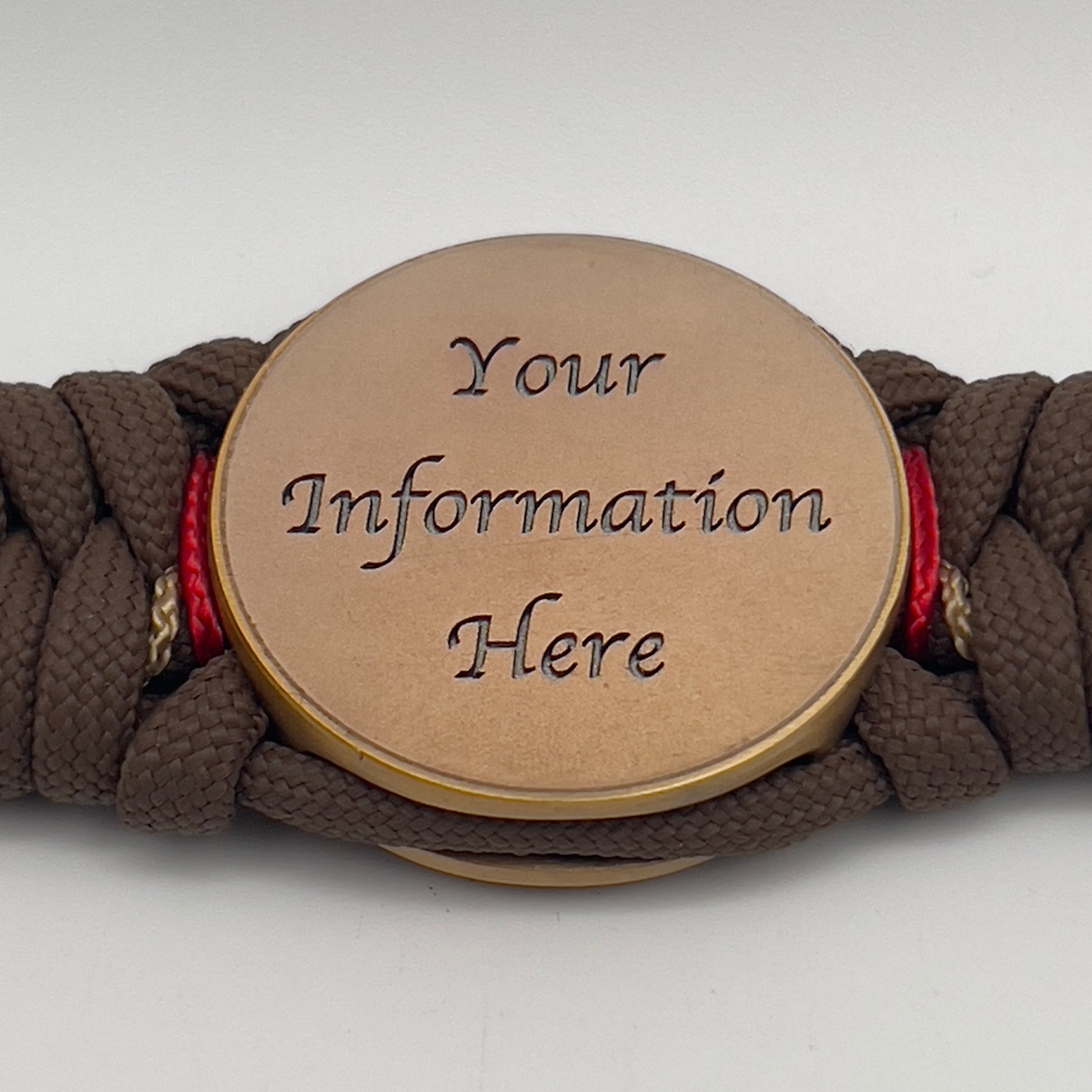 Thick, medium width, rigid and comfortable braided United States Marine Corps bracelet featuring a 24K antique gold plated USMC Eagle Globe and Anchor medallion, a gold Cobra style tactical buckle and woven with Coyote Brown 550 paracord and Imperial Red and Gold micro cord.
