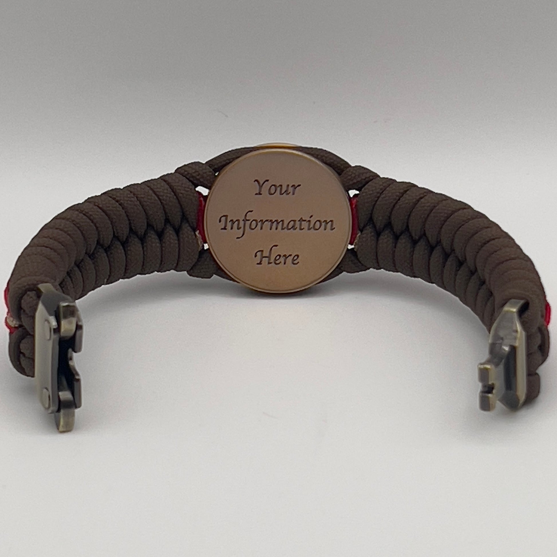 Thick, medium width, rigid and comfortable braided United States Marine Corps bracelet featuring a 24K antique gold plated USMC Eagle Globe and Anchor medallion, a gold Cobra style tactical buckle and woven with Coyote Brown 550 paracord and Imperial Red and Gold micro cord.