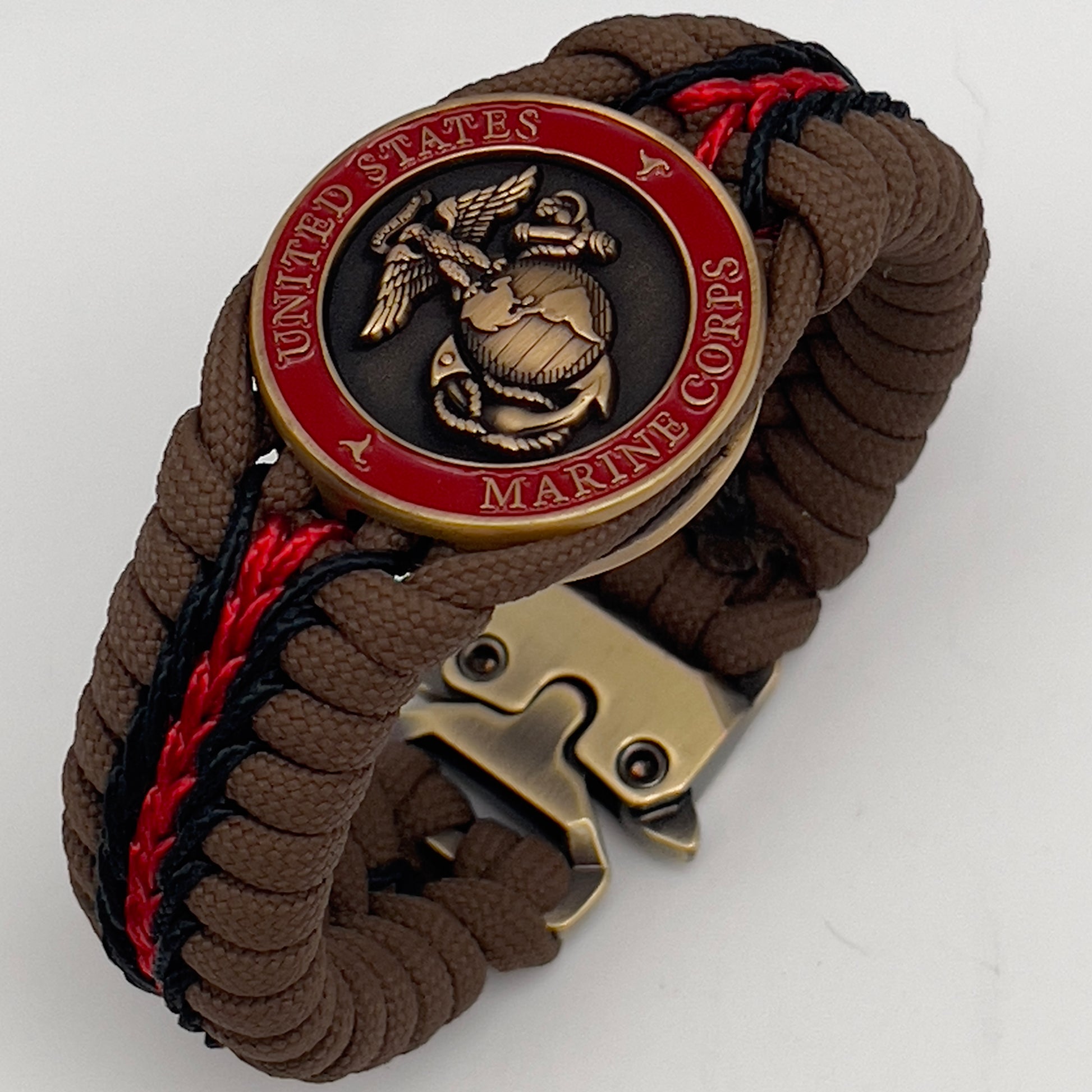 Thick, medium width, rigid and comfortable braided United States Marine Corps bracelet featuring a 24K antique gold plated USMC Eagle Globe and Anchor medallion, a gold Cobra style tactical buckle and woven with Coyote Brown 550 paracord and Imperial Red and Black micro cord.