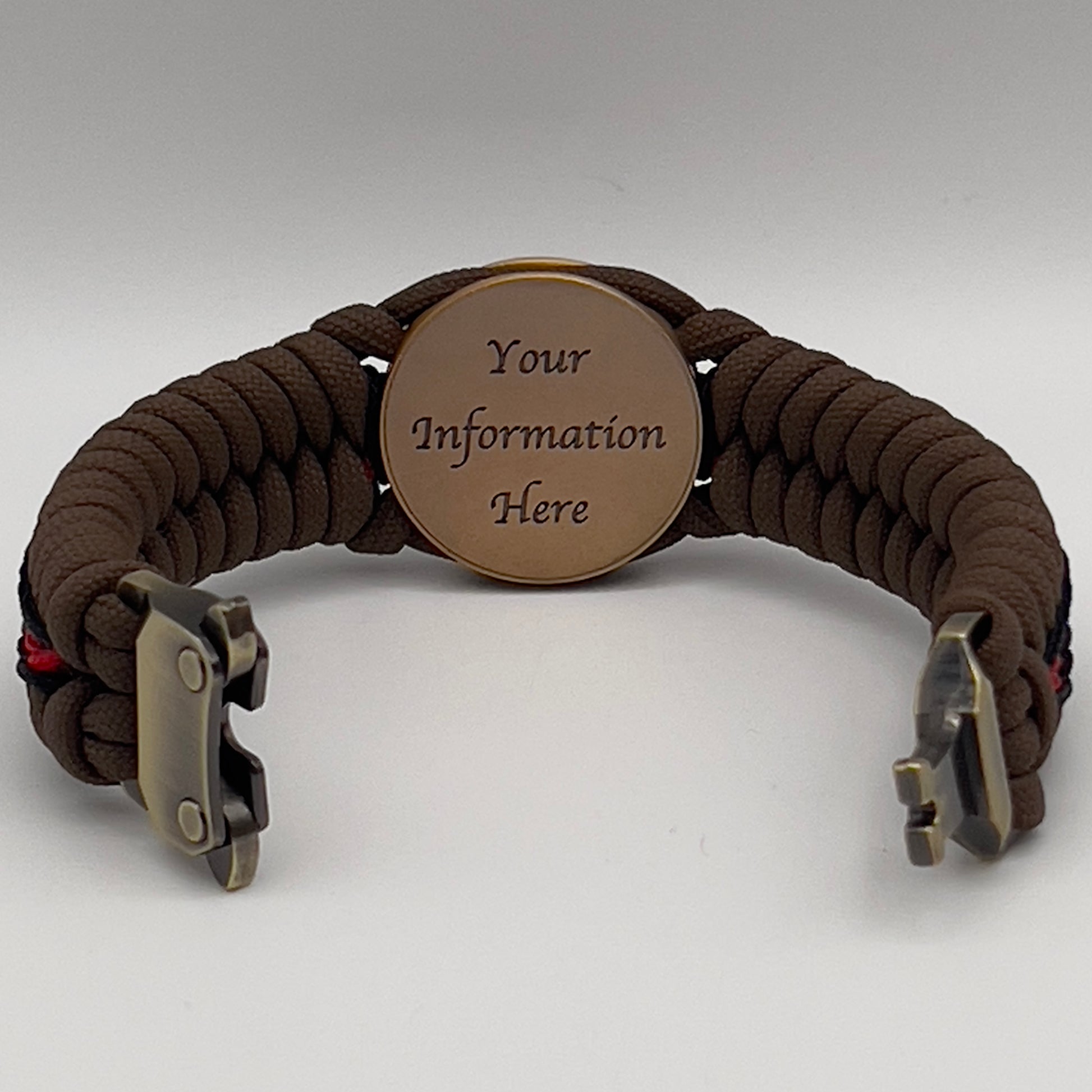 Thick, medium width, rigid and comfortable braided United States Marine Corps bracelet featuring a 24K antique gold plated USMC Eagle Globe and Anchor medallion, a gold Cobra style tactical buckle and woven with Coyote Brown 550 paracord and Imperial Red and Black micro cord.