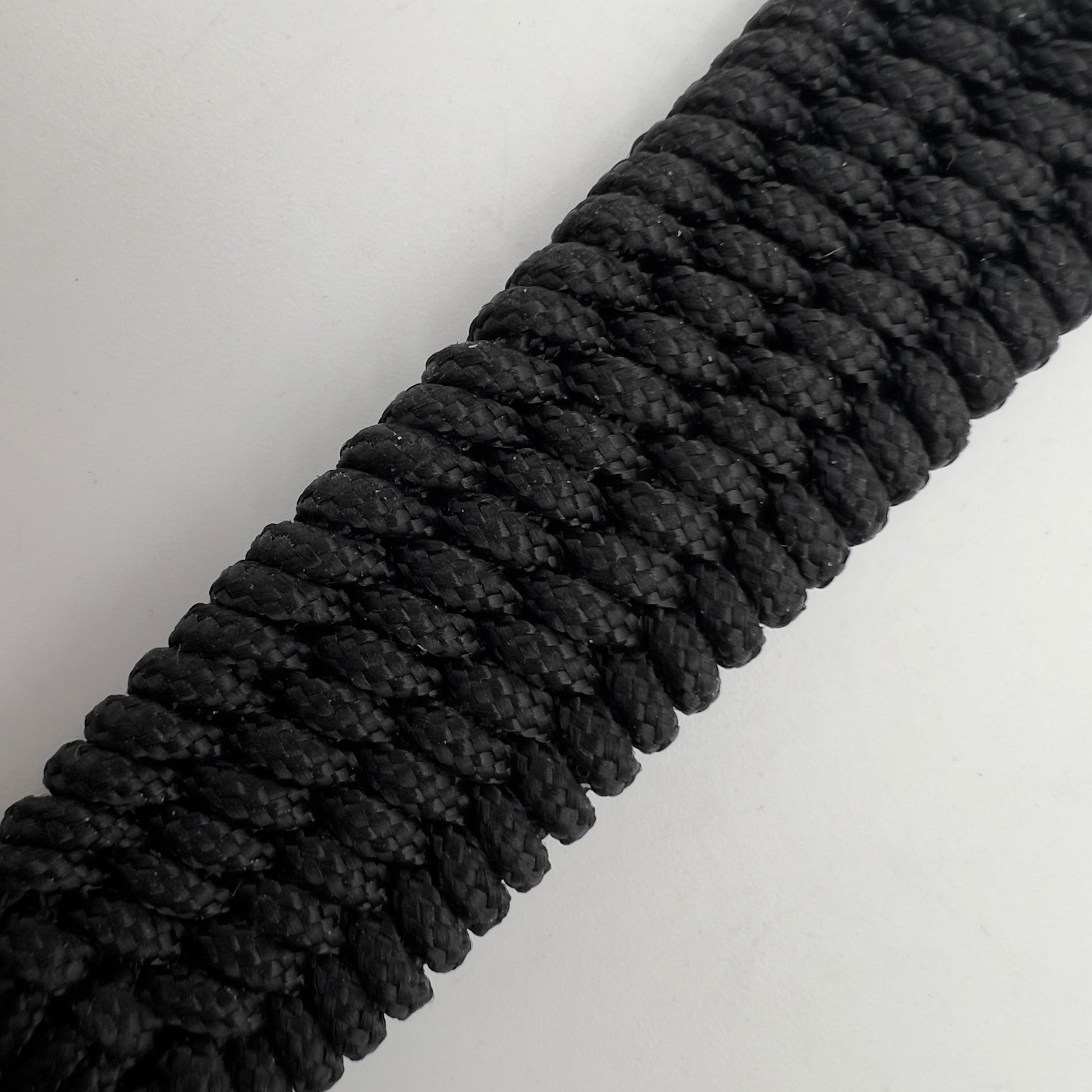 Thin, medium wide, very thin and flexible and comfortable braided United States Marine Corps bracelet featuring a 24K antique gold plated USMC Eagle Globe and Anchor medallion, a black Cobra style tactical buckle and woven with black Type-1 paracord.