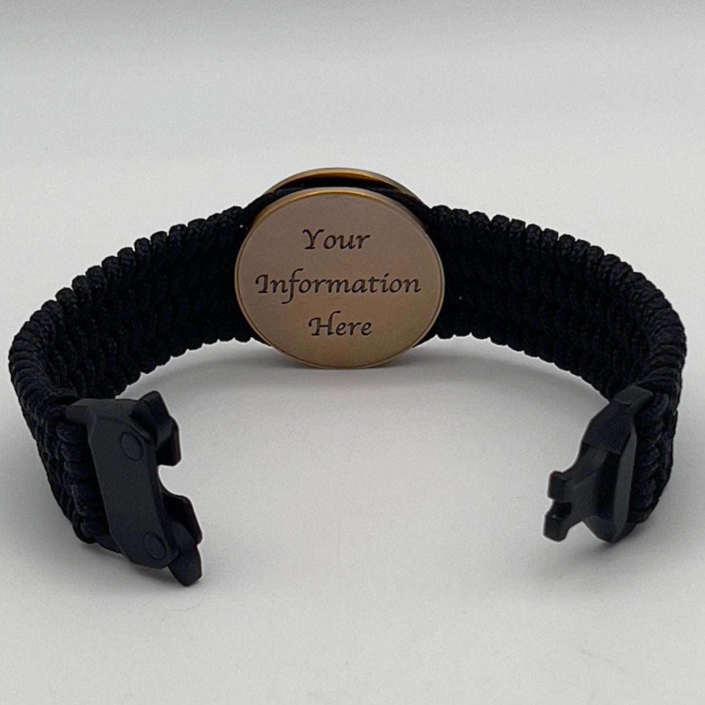 Thin, medium wide, very thin and flexible and comfortable braided United States Marine Corps bracelet featuring a 24K antique gold plated USMC Eagle Globe and Anchor medallion, a black Cobra style tactical buckle and woven with black Type-1 paracord.