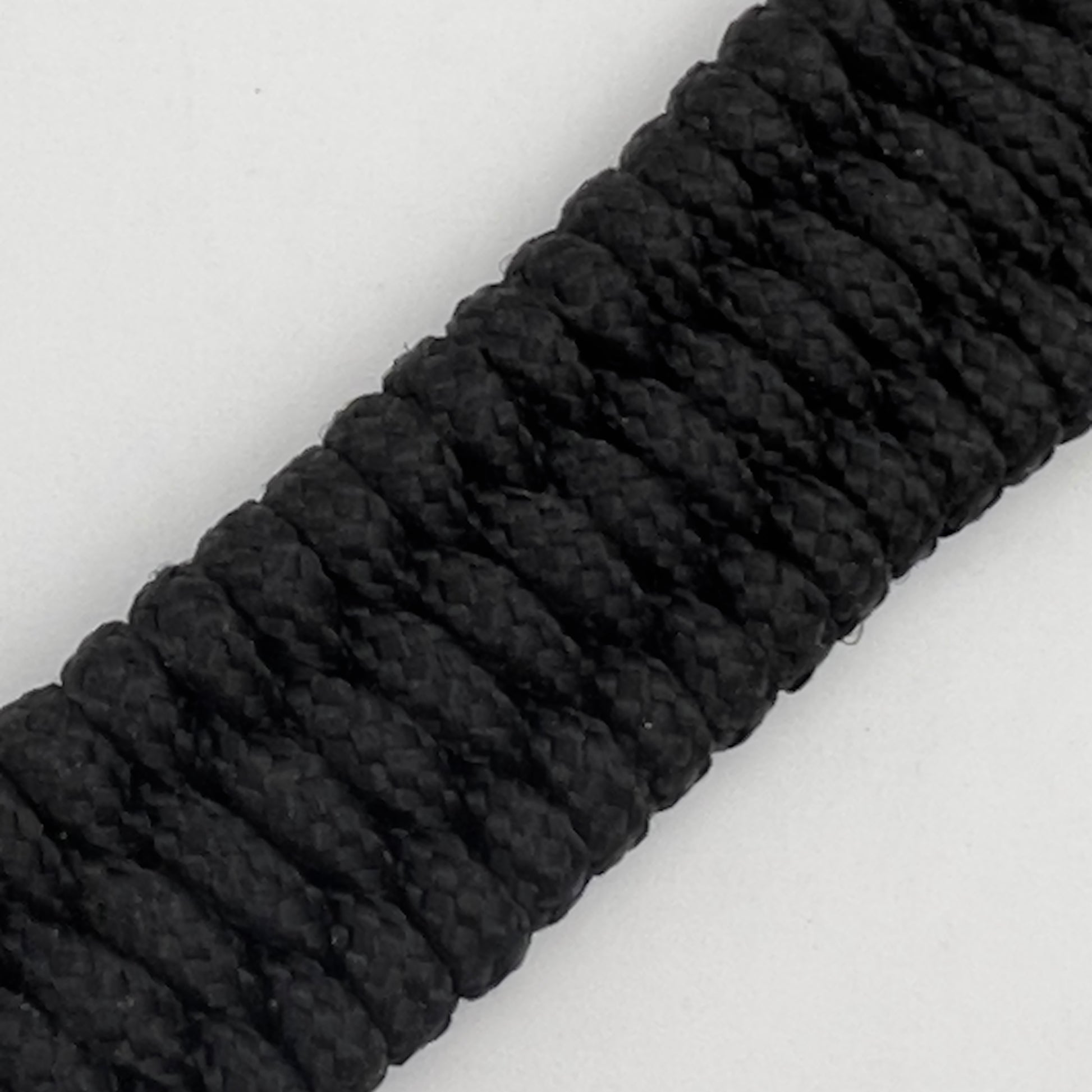 Thin, narrow, flexible and comfortable braided United States Marine Corps bracelet featuring a 24K antique gold plated USMC Eagle Globe and Anchor medallion, a black Cobra style tactical buckle and woven with black Type-1 paracord.