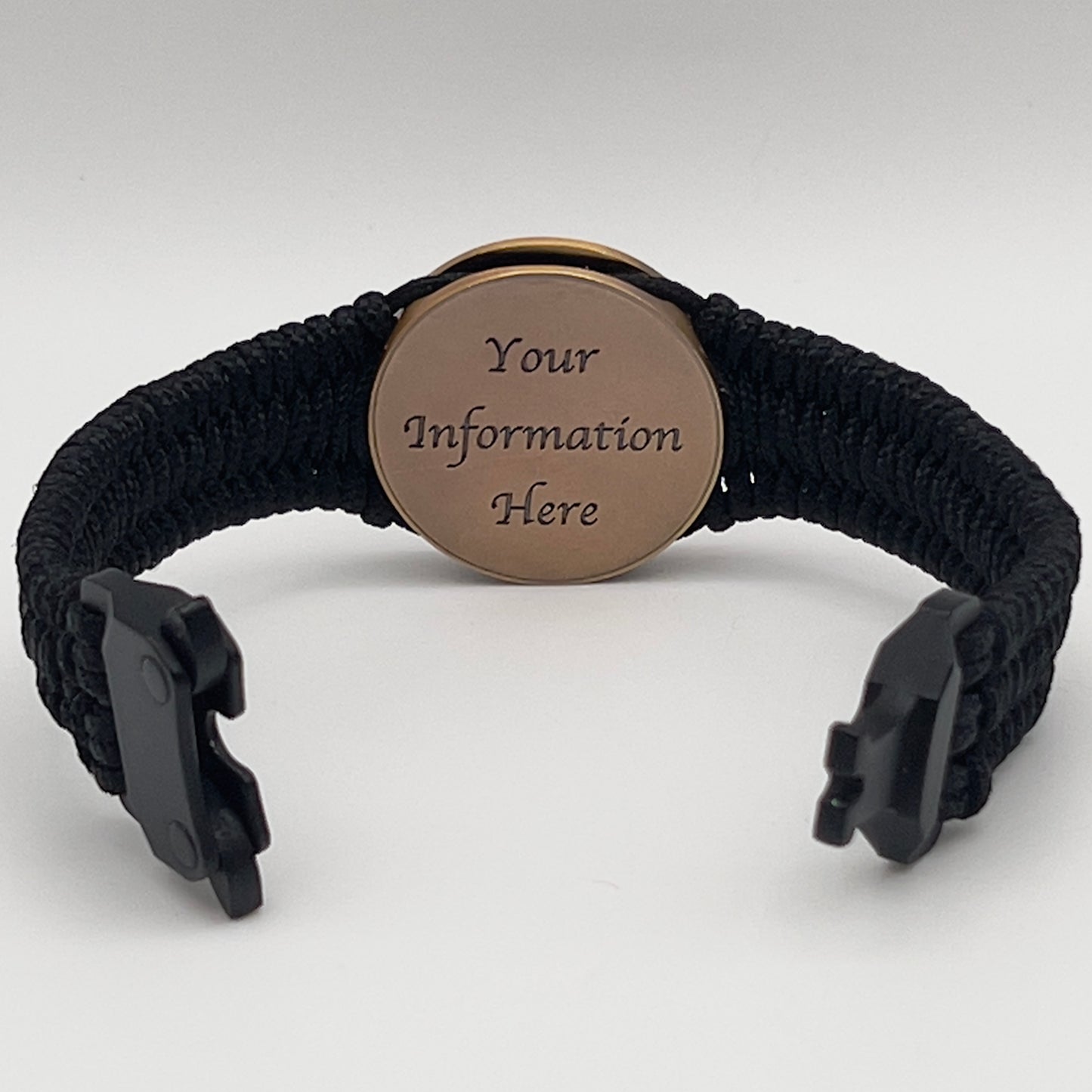 Thin, narrow, flexible and comfortable braided United States Marine Corps bracelet featuring a 24K antique gold plated USMC Eagle Globe and Anchor medallion, a black Cobra style tactical buckle and woven with black Type-1 paracord.