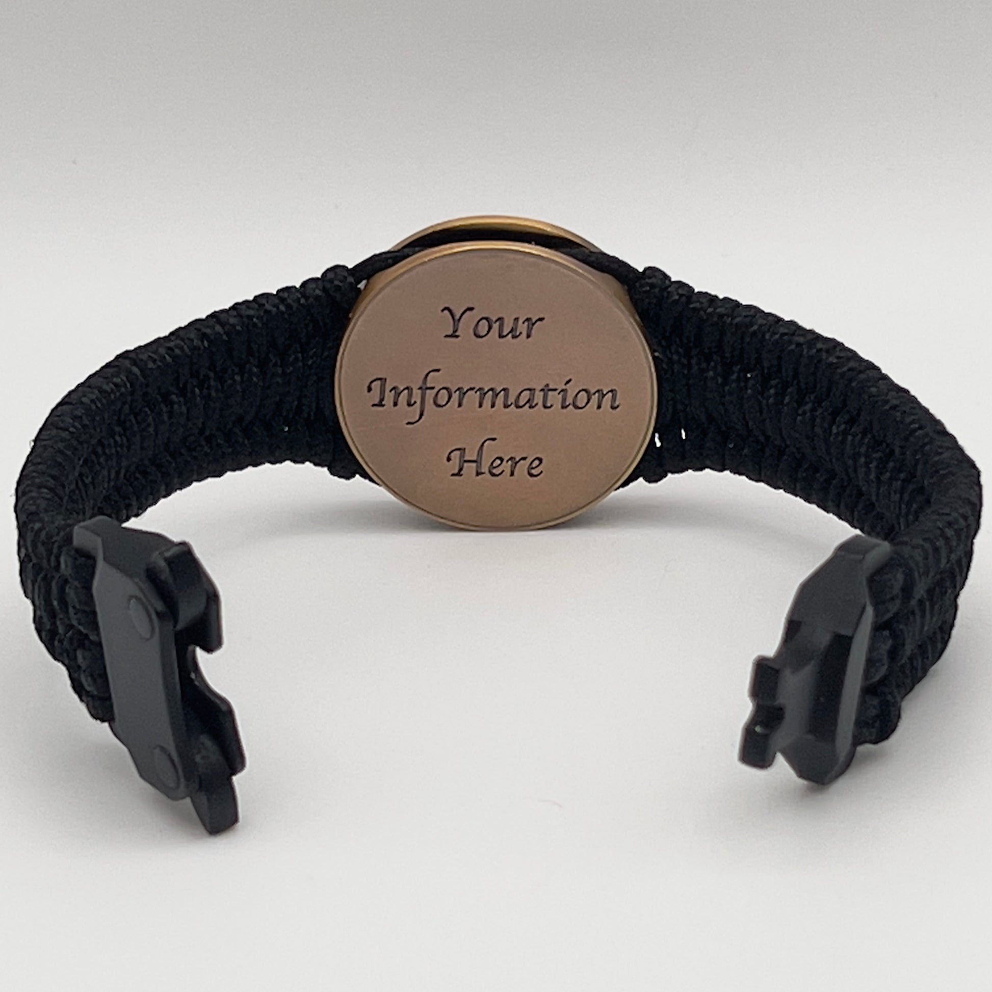 Thin, narrow, flexible and comfortable braided United States Marine Corps bracelet featuring a 24K antique gold plated USMC Eagle Globe and Anchor medallion, a black Cobra style tactical buckle and woven with black Type-1 paracord.