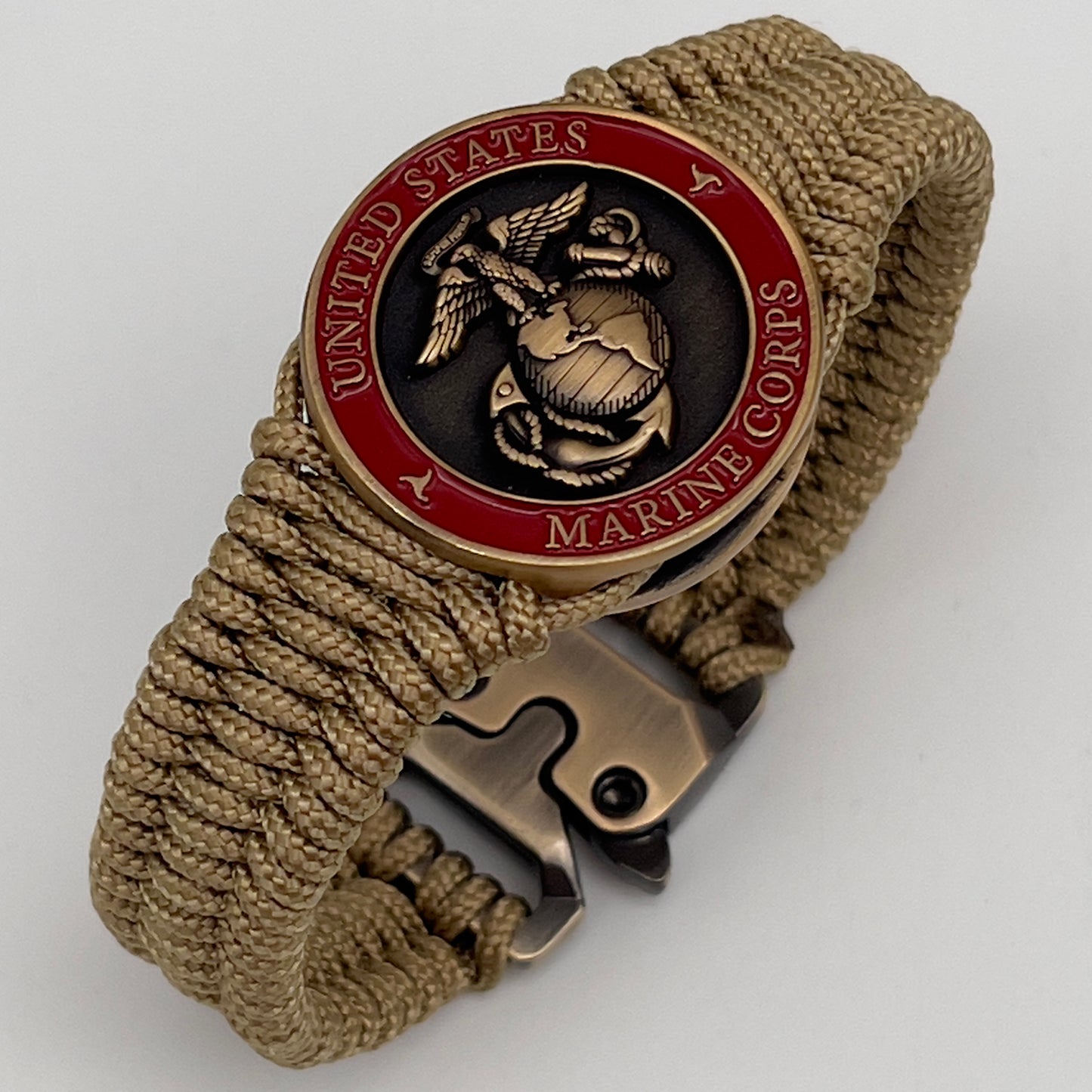 Thin, narrow, very thin and flexible and comfortable braided United States Marine Corps bracelet featuring a 24K antique gold plated USMC Eagle Globe and Anchor medallion, a gold Cobra style tactical buckle and woven with gold Type-1 paracord.