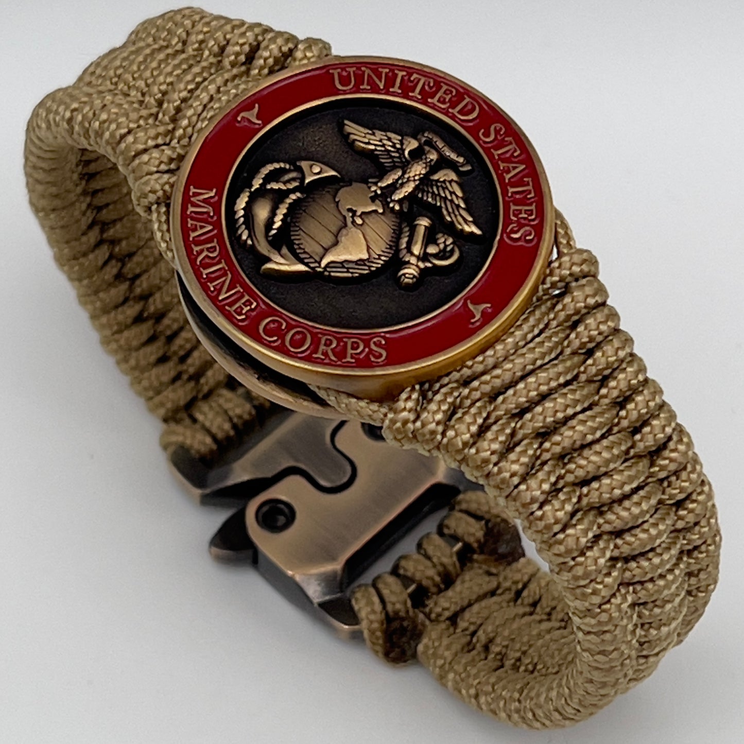 Thin, narrow, very thin and flexible and comfortable braided United States Marine Corps bracelet featuring a 24K antique gold plated USMC Eagle Globe and Anchor medallion, a gold Cobra style tactical buckle and woven with gold Type-1 paracord.