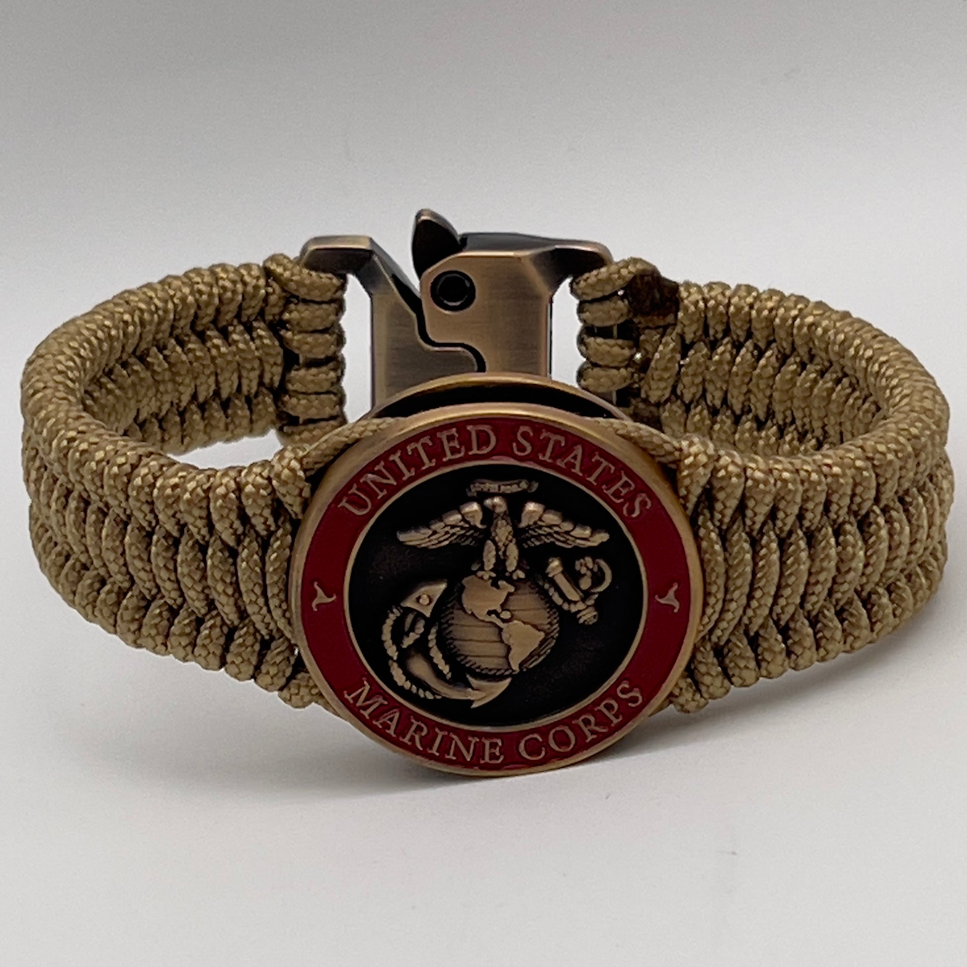 Thin, narrow, very thin and flexible and comfortable braided United States Marine Corps bracelet featuring a 24K antique gold plated USMC Eagle Globe and Anchor medallion, a gold Cobra style tactical buckle and woven with gold Type-1 paracord.