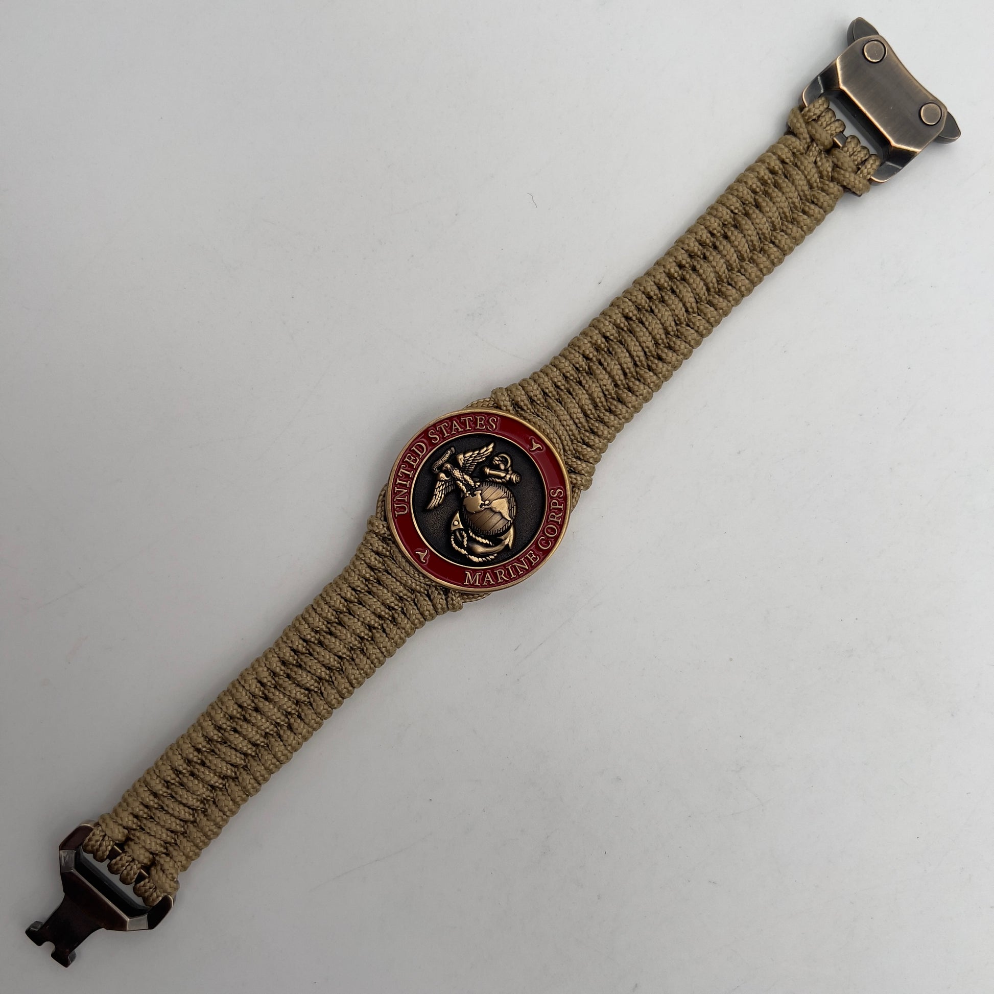 Thin, narrow, very thin and flexible and comfortable braided United States Marine Corps bracelet featuring a 24K antique gold plated USMC Eagle Globe and Anchor medallion, a gold Cobra style tactical buckle and woven with gold Type-1 paracord.