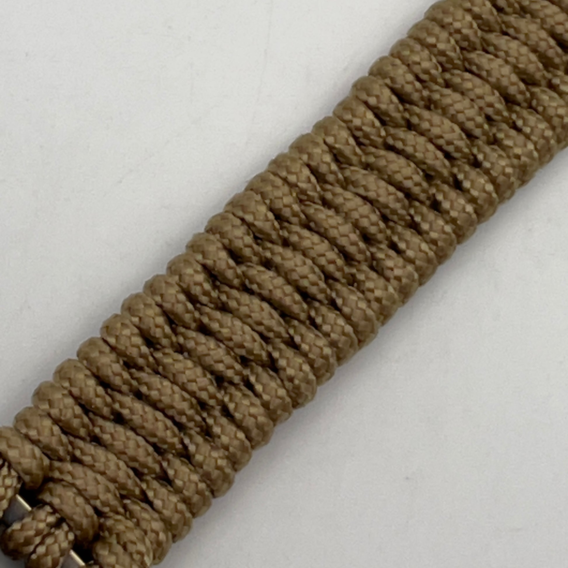 Thin, narrow, very thin and flexible and comfortable braided United States Marine Corps bracelet featuring a 24K antique gold plated USMC Eagle Globe and Anchor medallion, a gold Cobra style tactical buckle and woven with gold Type-1 paracord.