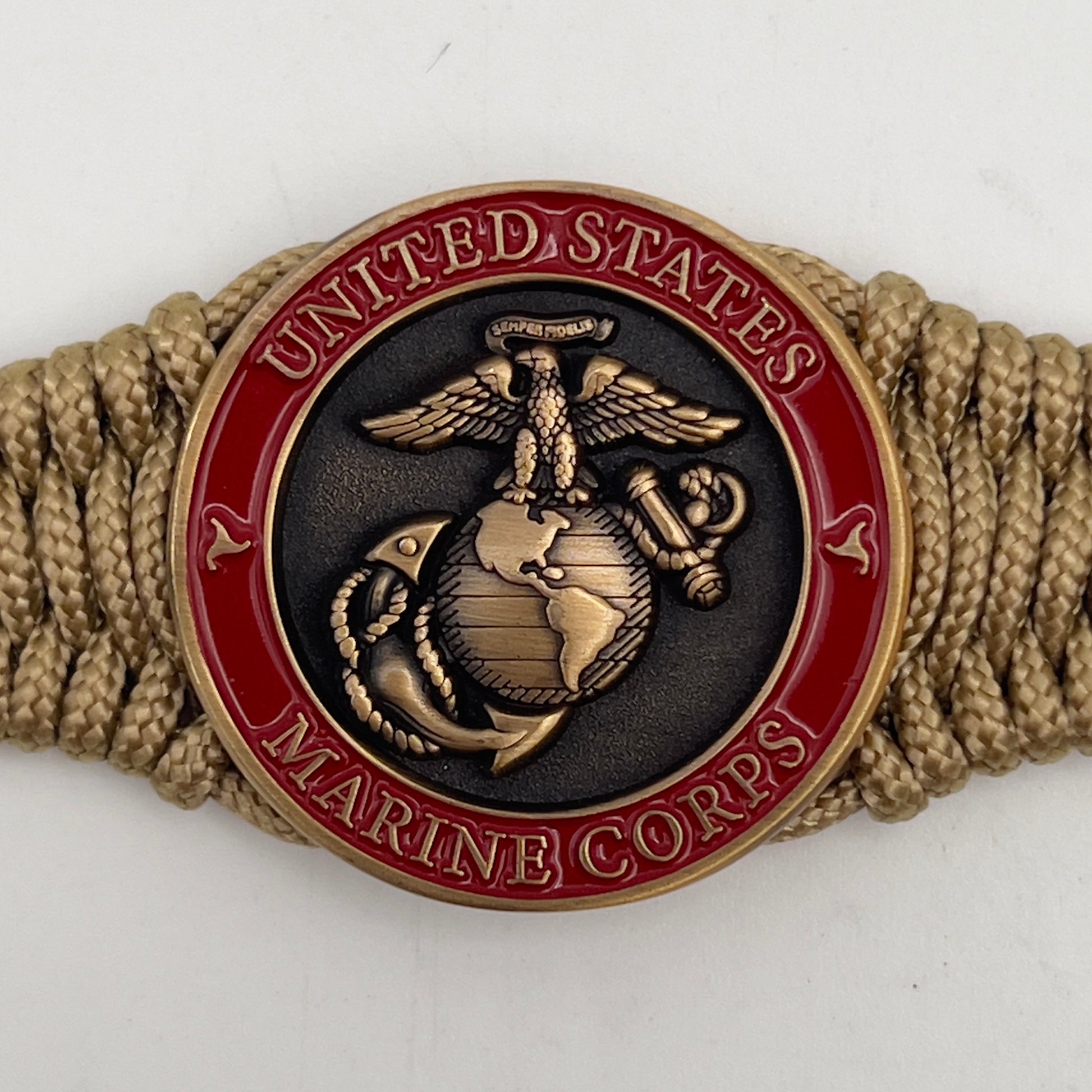 Thin, narrow, very thin and flexible and comfortable braided United States Marine Corps bracelet featuring a 24K antique gold plated USMC Eagle Globe and Anchor medallion, a gold Cobra style tactical buckle and woven with gold Type-1 paracord.