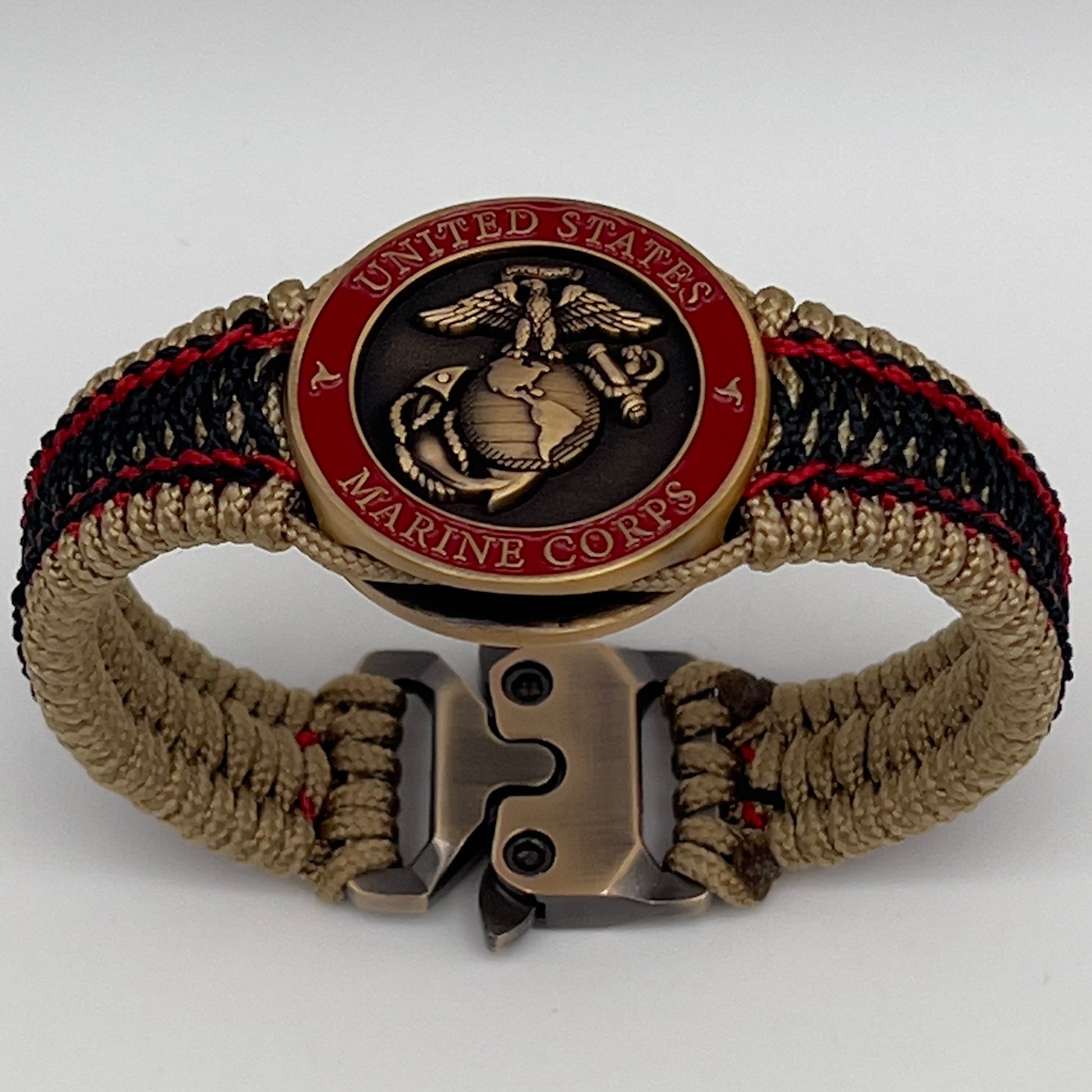 Thin, narrow, very thin and flexible and comfortable braided United States Marine Corps bracelet featuring a 24K antique gold plated USMC Eagle Globe and Anchor medallion, a gold Cobra style tactical buckle and woven with gold Type-1 paracord and Imperial Red and Black nano cord.