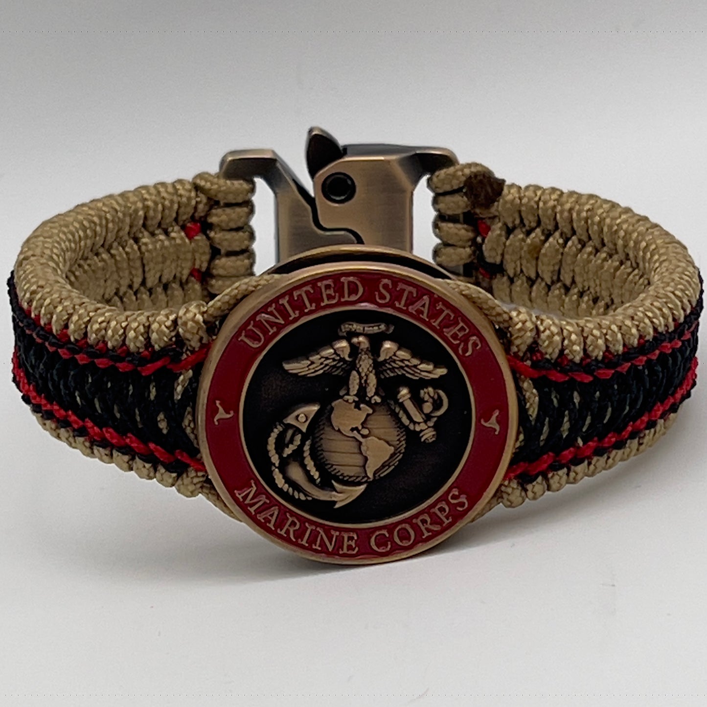 Thin, narrow, very thin and flexible and comfortable braided United States Marine Corps bracelet featuring a 24K antique gold plated USMC Eagle Globe and Anchor medallion, a gold Cobra style tactical buckle and woven with gold Type-1 paracord and Imperial Red and Black nano cord.