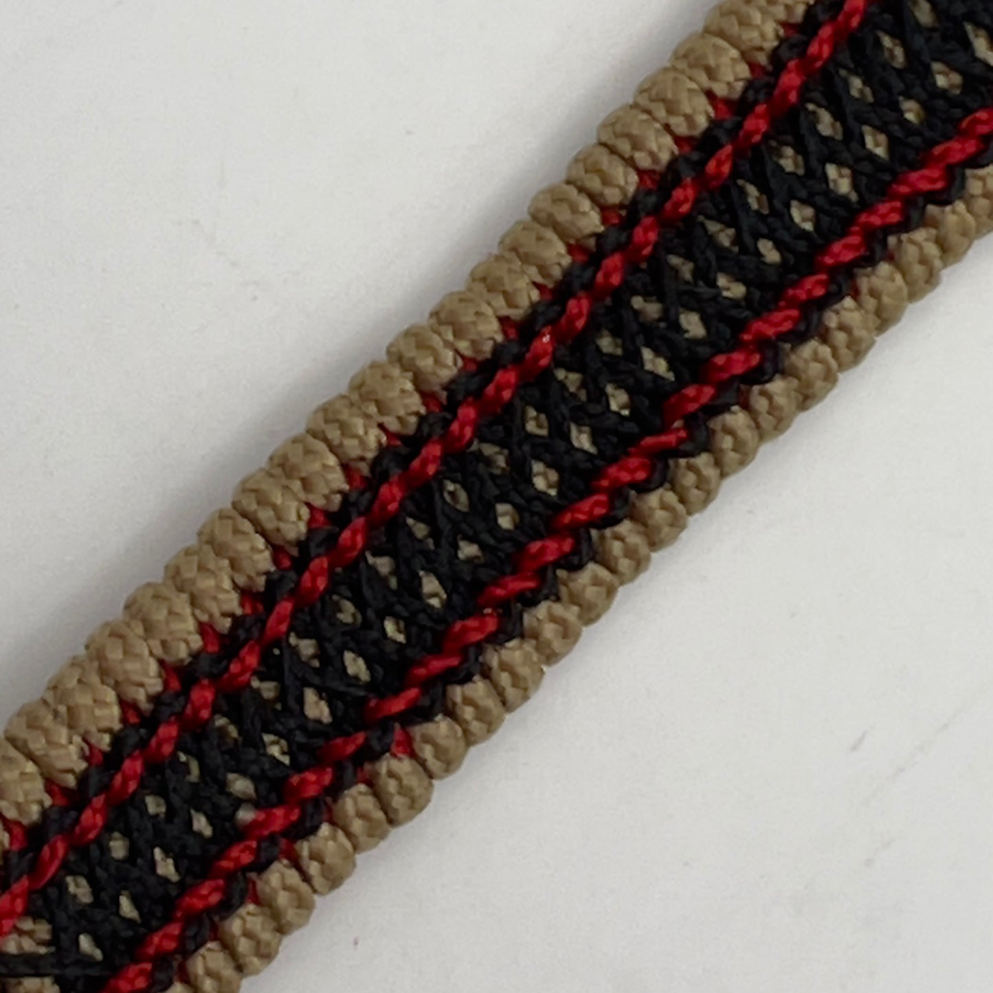 Thin, narrow, very thin and flexible and comfortable braided United States Marine Corps bracelet featuring a 24K antique gold plated USMC Eagle Globe and Anchor medallion, a gold Cobra style tactical buckle and woven with gold Type-1 paracord and Imperial Red and Black nano cord.