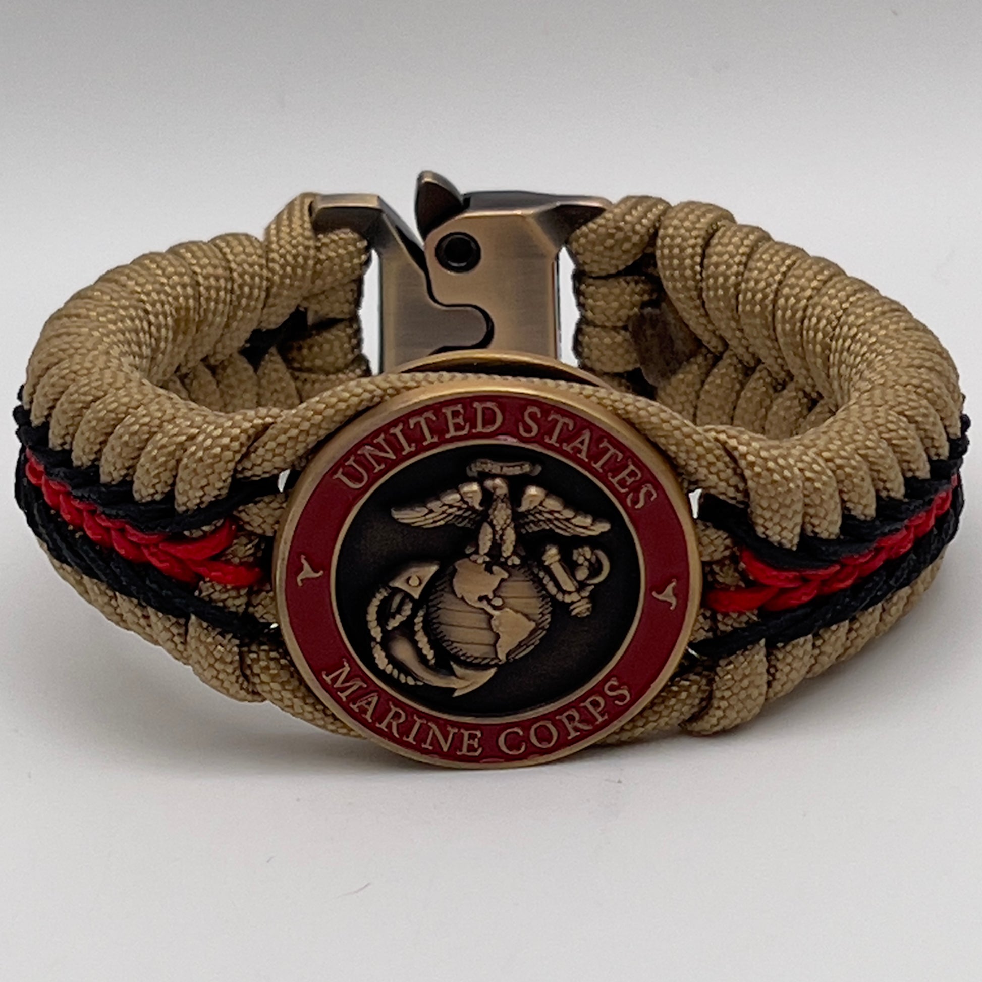 Thick, medium width, rigid and comfortable braided United States Marine Corps bracelet featuring a 24K antique gold plated USMC Eagle Globe and Anchor medallion, a gold Cobra style tactical buckle and woven with gold 550 paracord and Imperial red and black micro cord.