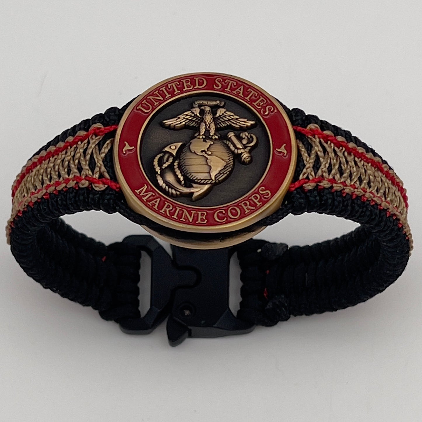 Thin, narrow, very thin and flexible and comfortable braided United States Marine Corps bracelet featuring a 24K antique gold plated USMC Eagle Globe and Anchor medallion, a black Cobra style tactical buckle and woven with black Type-1 paracord and Imperial Red and GOld nano cord.