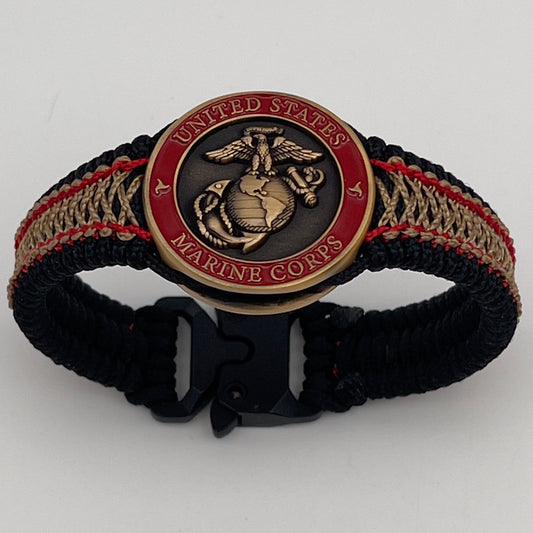 Thin, narrow, very thin and flexible and comfortable braided United States Marine Corps bracelet featuring a 24K antique gold plated USMC Eagle Globe and Anchor medallion, a black Cobra style tactical buckle and woven with black Type-1 paracord and Imperial Red and GOld nano cord.