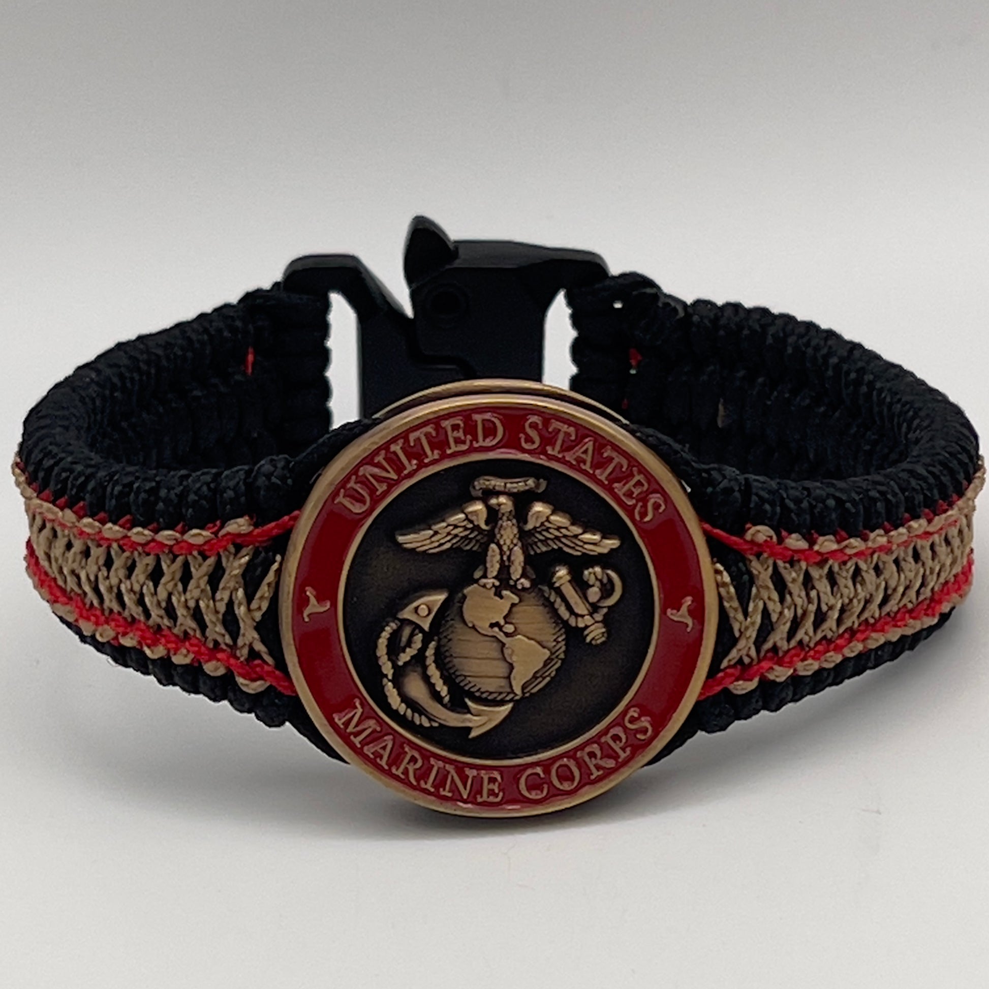 Thin, narrow, very thin and flexible and comfortable braided United States Marine Corps bracelet featuring a 24K antique gold plated USMC Eagle Globe and Anchor medallion, a black Cobra style tactical buckle and woven with black Type-1 paracord and Imperial Red and GOld nano cord.