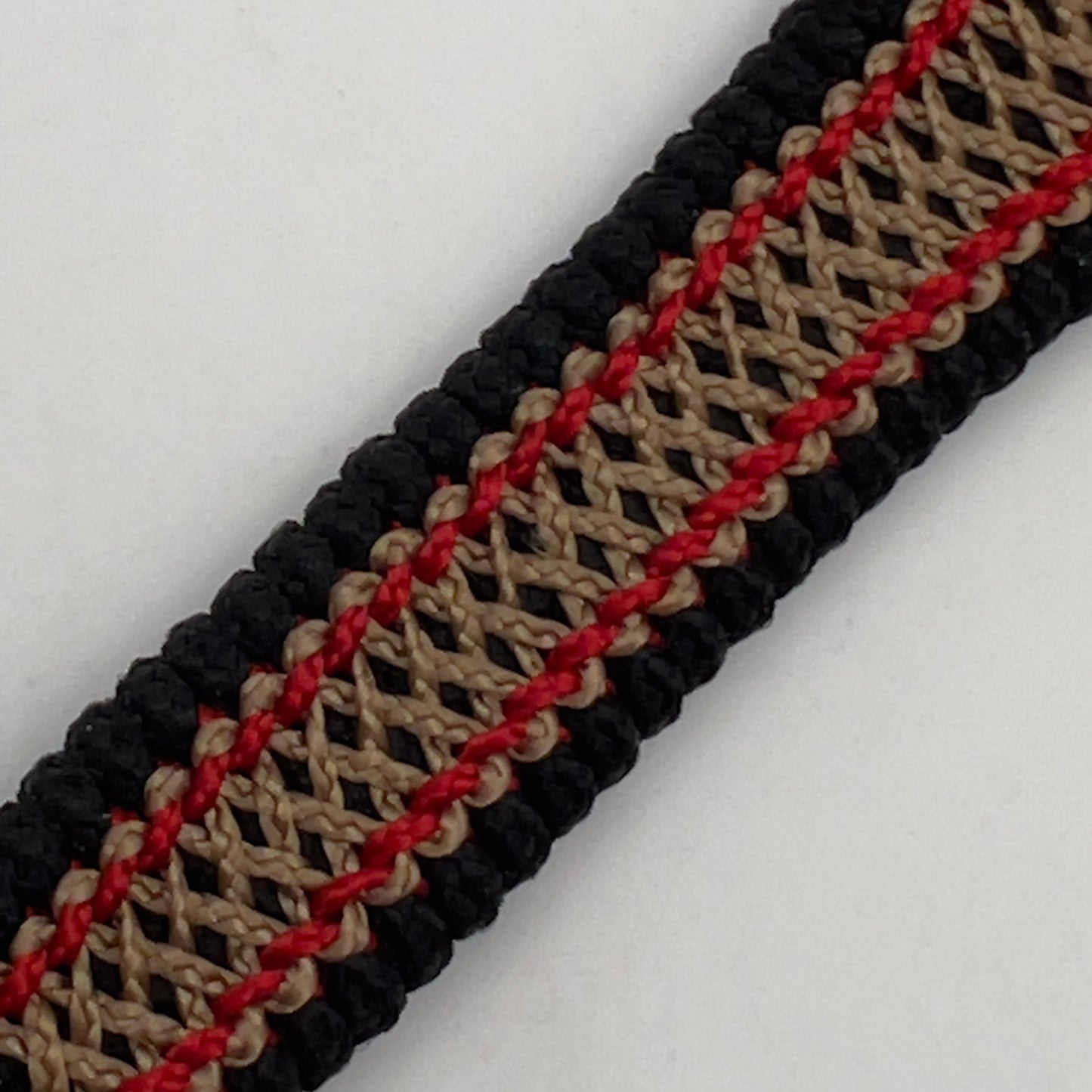 Thin, narrow, very thin and flexible and comfortable braided United States Marine Corps bracelet featuring a 24K antique gold plated USMC Eagle Globe and Anchor medallion, a black Cobra style tactical buckle and woven with black Type-1 paracord and Imperial Red and GOld nano cord.